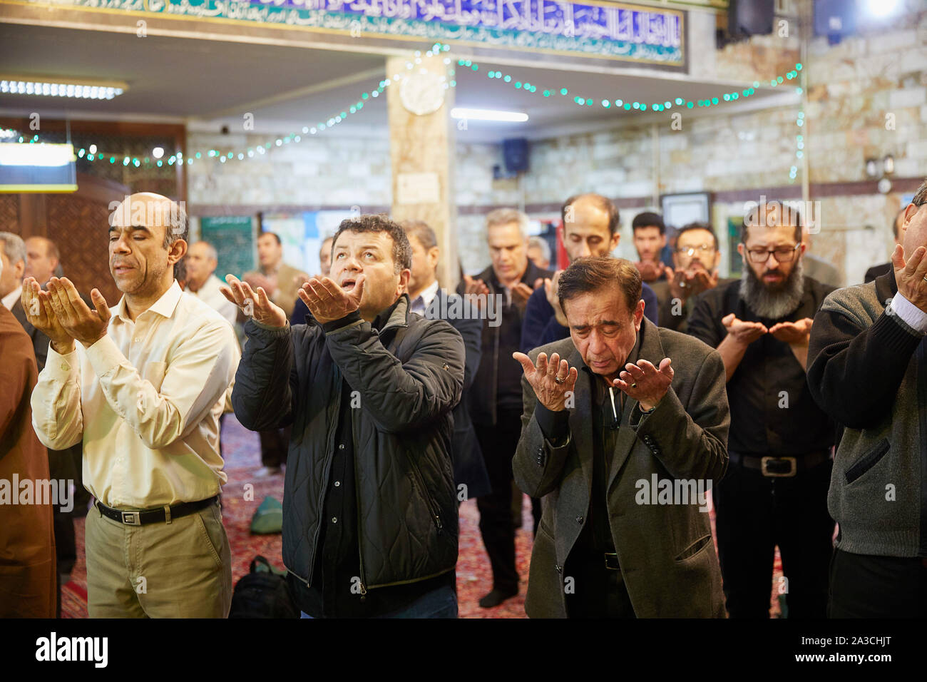 Iran Tehran Mosque Moslim Islam The 8 o clock praying in the mosque, the man part 01-04-2017 foto: Jaco Klamer Stock Photo