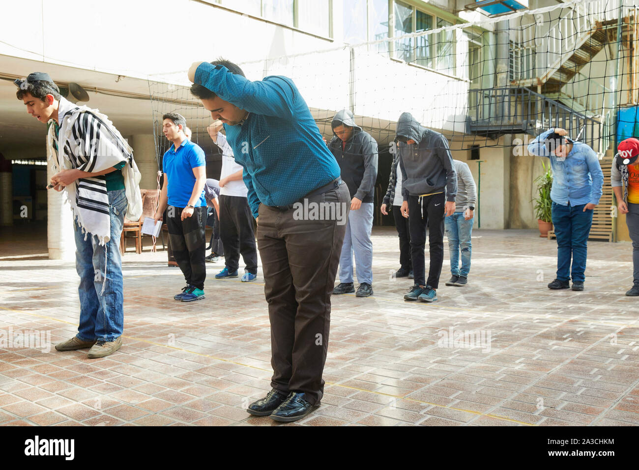 Iran Teheran boys and teachers praying and sporting highschool Mozes the son of Imram 30-03-2017 foto: Jaco Klamer Stock Photo