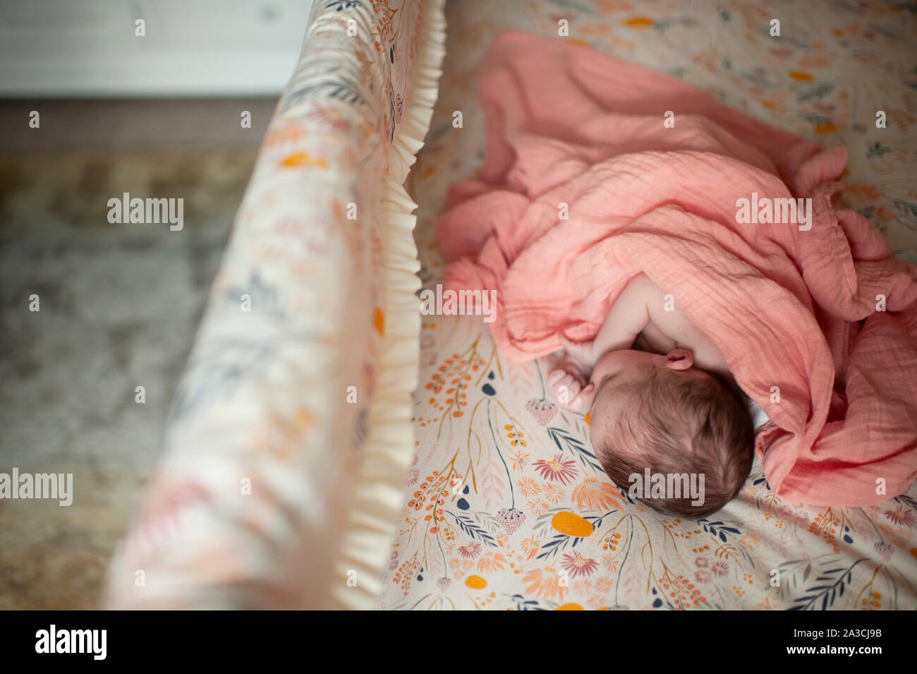 Newborn Baby Girl Sleeping In Crib