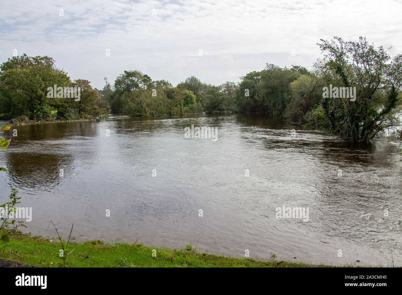 Skibbereen, West Cork, Ireland 7th October 2019. Torrential overnight rain caused the River Ilen north of Skibbereen to burst its banks, flooding low lying farmer’s fields and pastures. More heavy rain is expected today. Credit aphperspective/ Alamy Live News Stock Photo