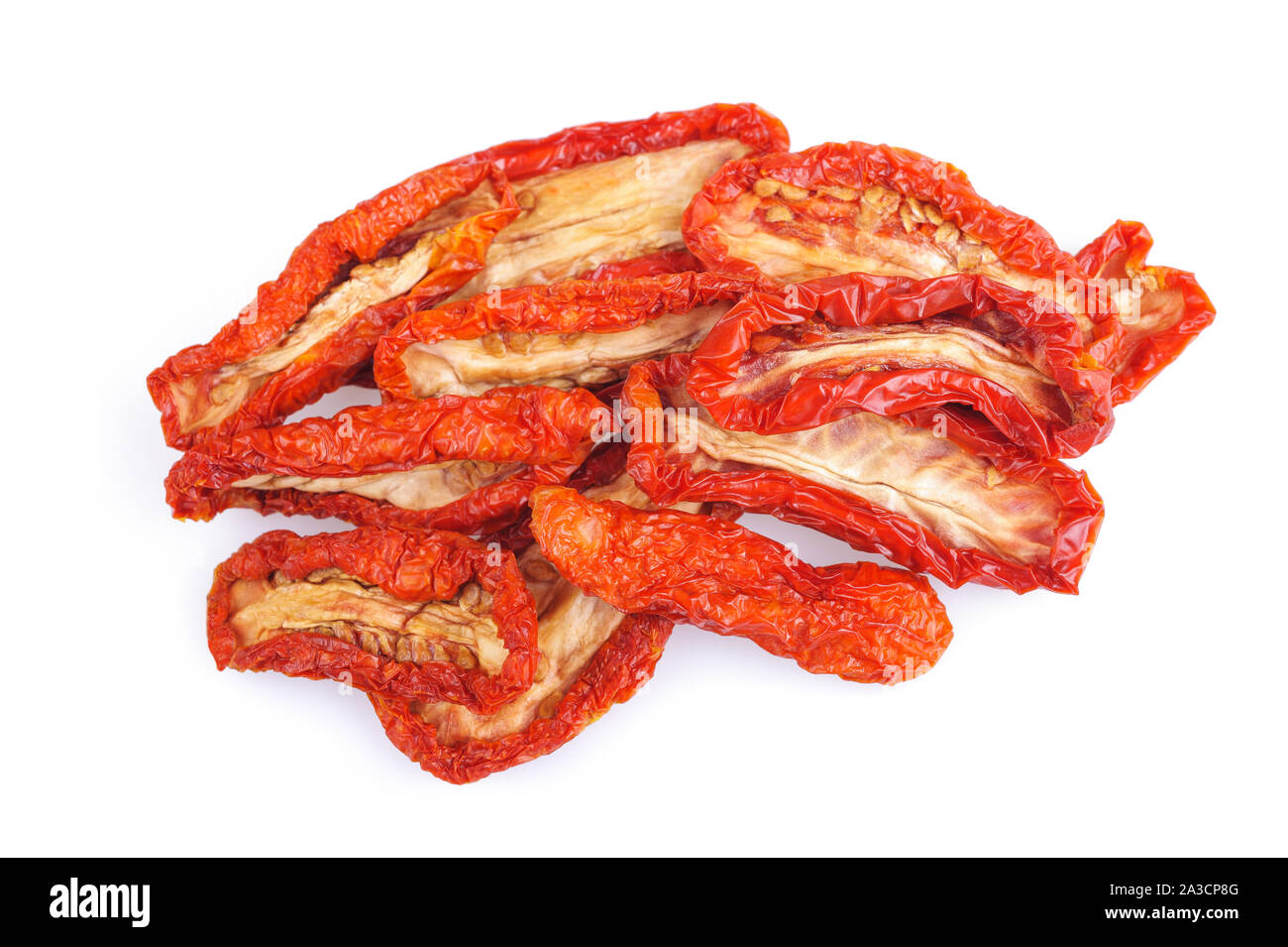 Dried tomatoes heap isolated on white background. Stock Photo