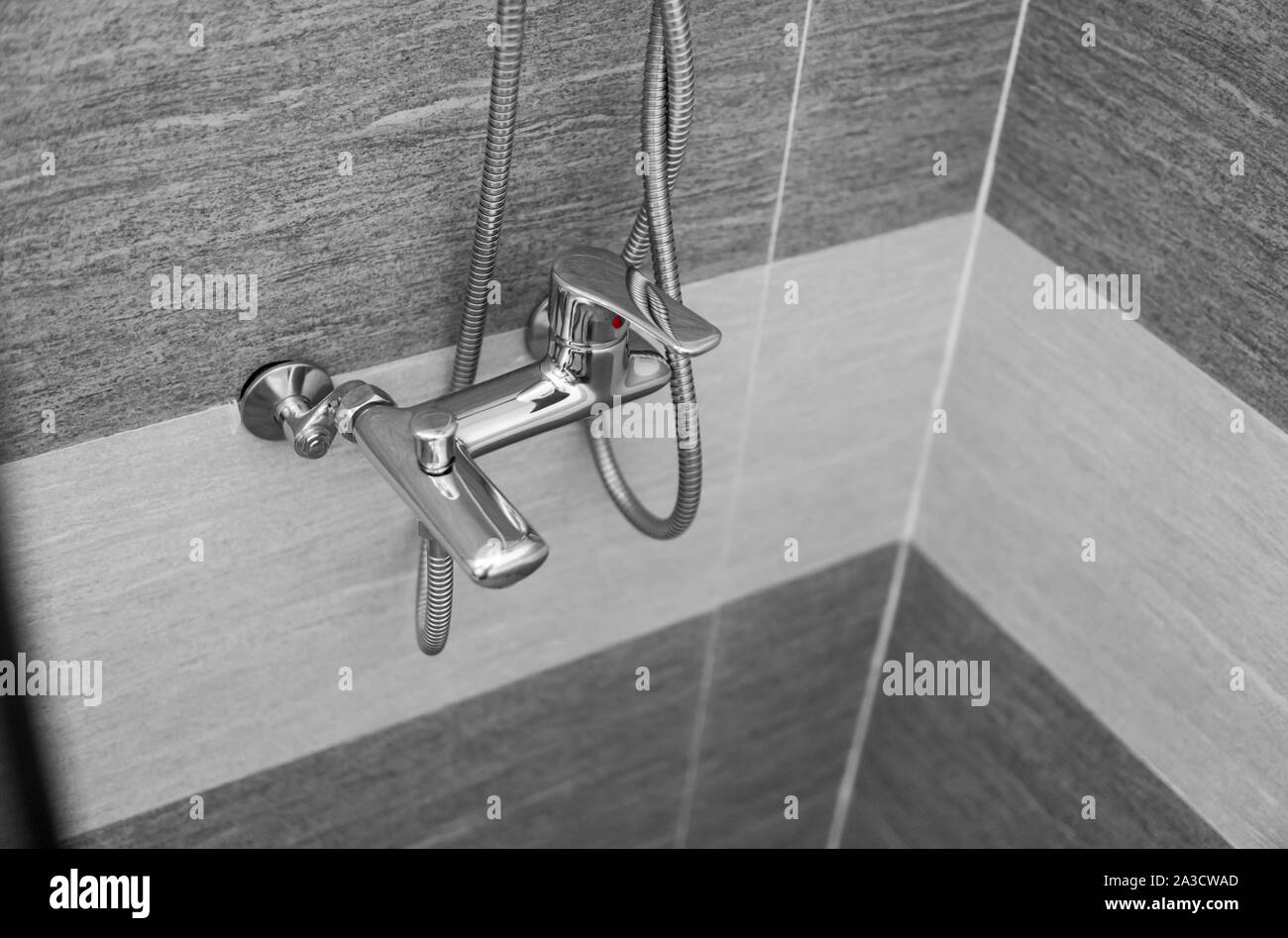 Modern Designer Tap And Shower In Bathroom Closeup Of Chrome
