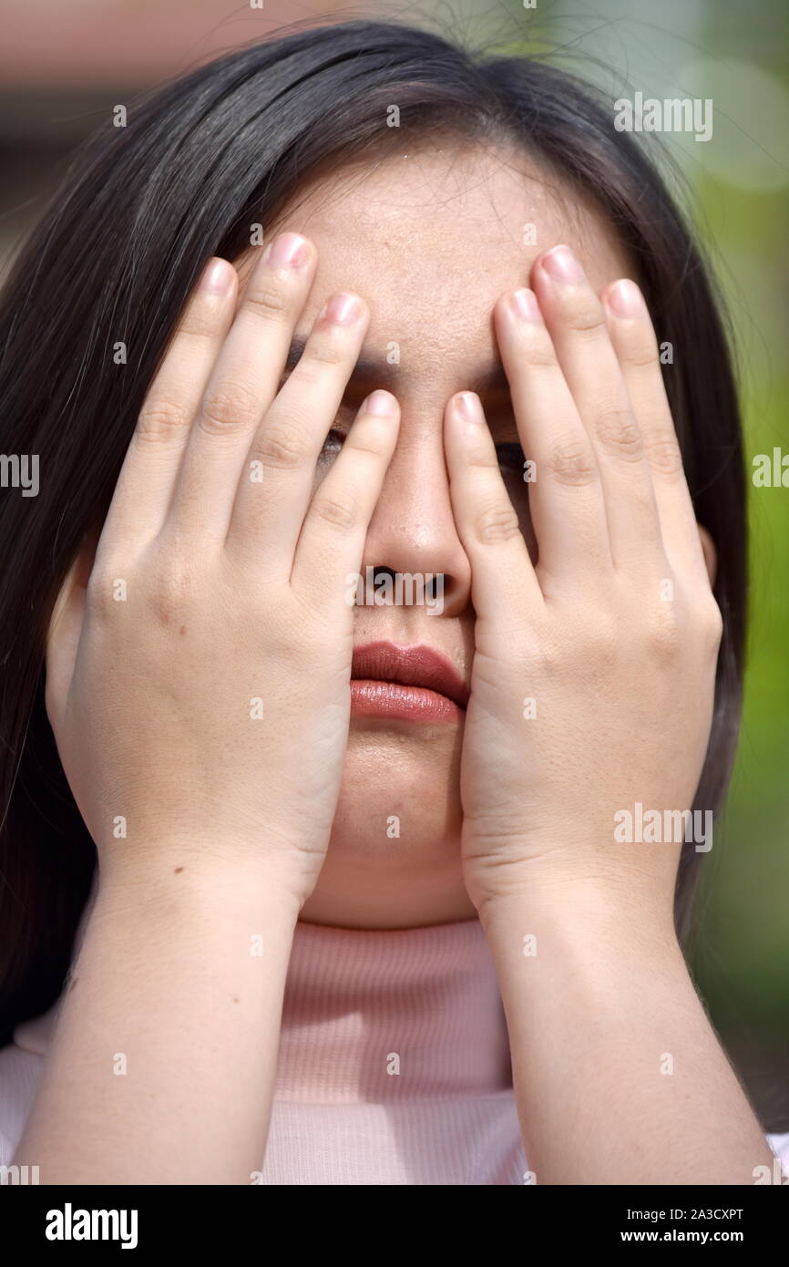 An Ashamed Youthful Diverse Female Stock Photo