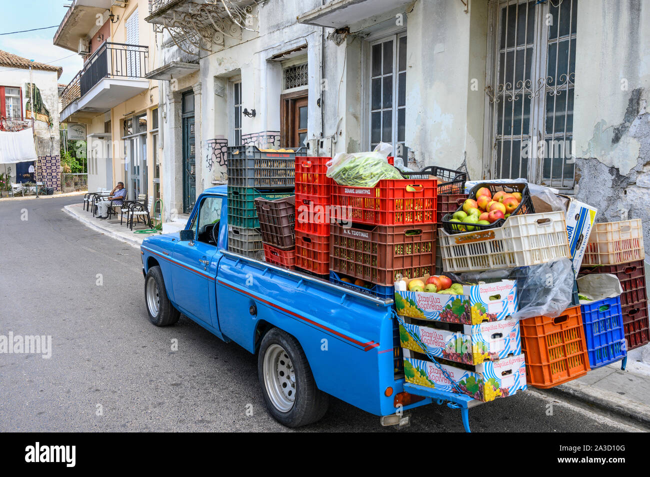 A manavis, a mobile fruit and vegetable seller,using an old and restored Mazda pickup truck, in