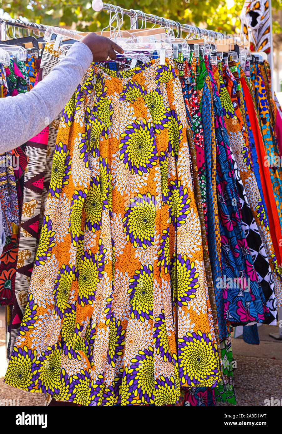 Beautiful West African clothing items for sale at an outdoor market ...