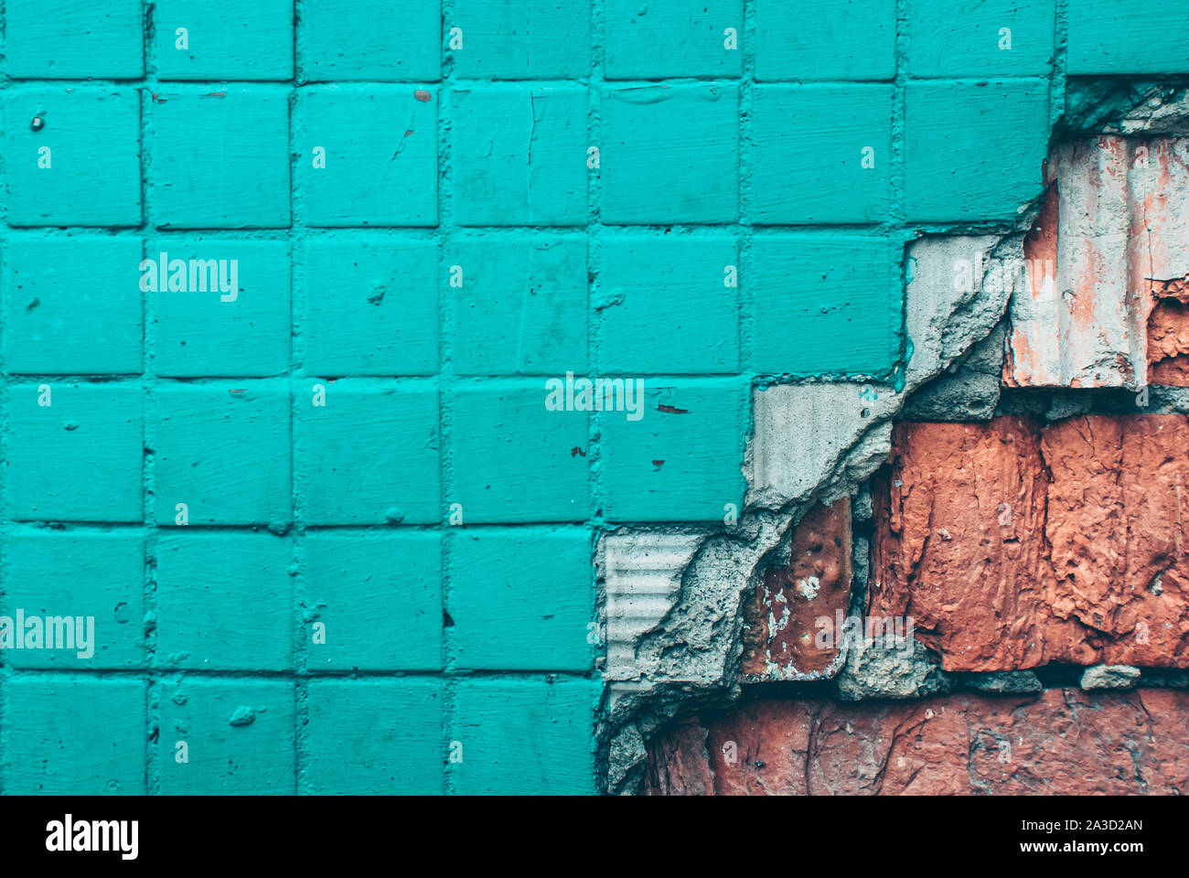 Texture of old tile wall. Background of Wall fragment with broken tile and bricks Stock Photo