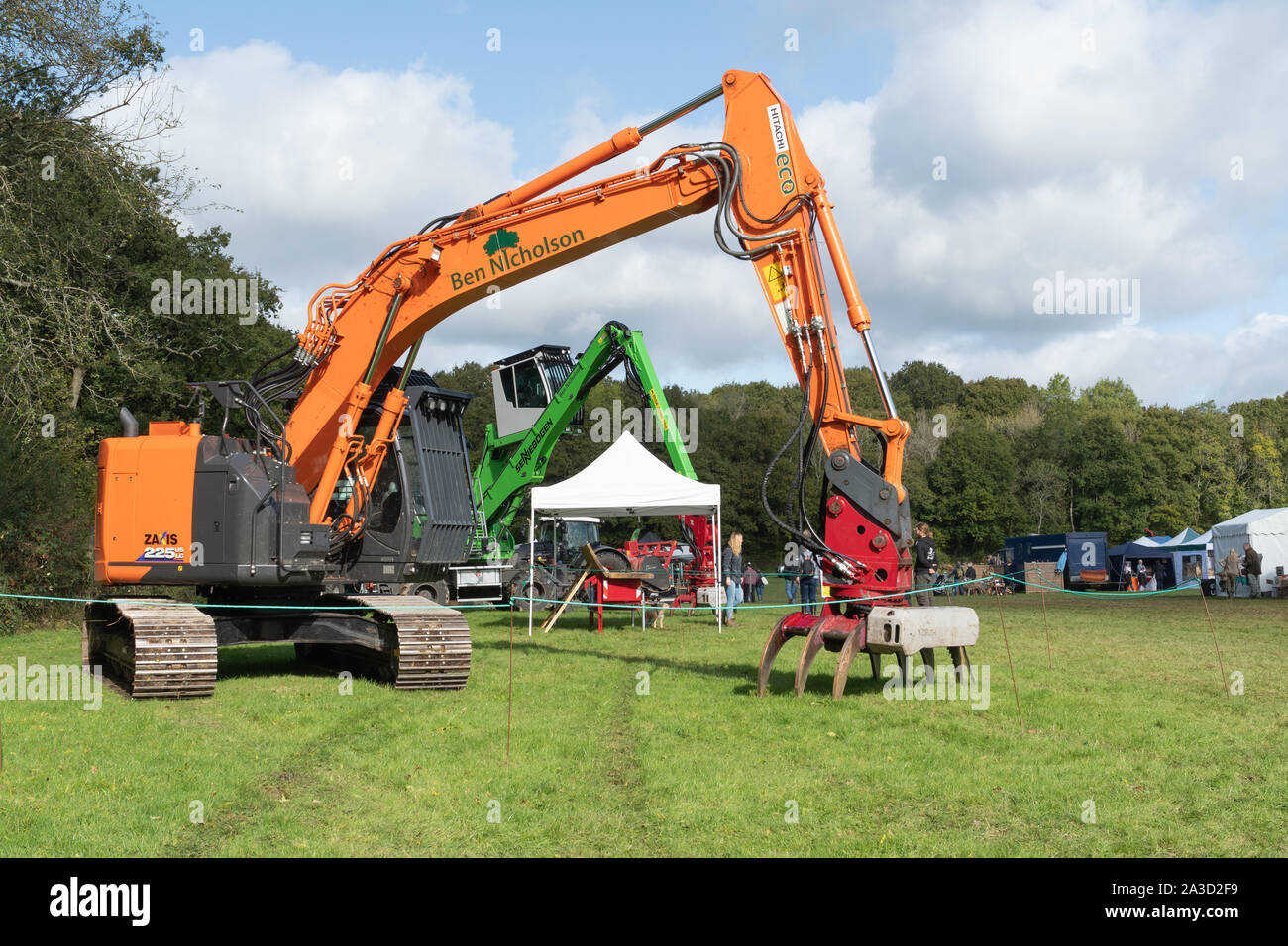View of the showground at the Surrey Hills Wood Fair, UK, with heavy machinery for tree surgery Stock Photo