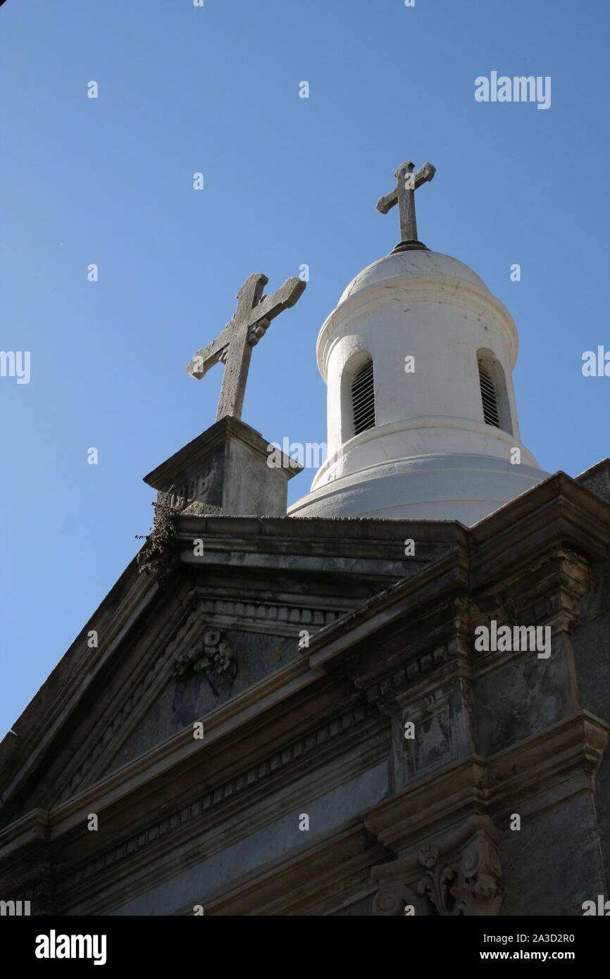 Crosses. A pair of crosses on the roof of a mausoleum. Stock Photo
