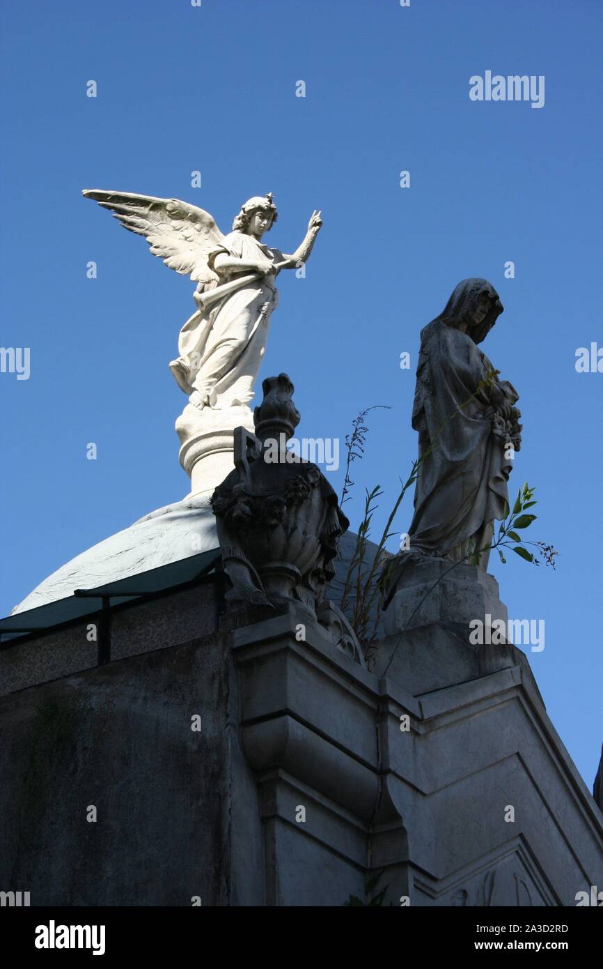 Sculpture in Recoleta Cemetery. Angel sculpture on the top of a mausoleum. Stock Photo