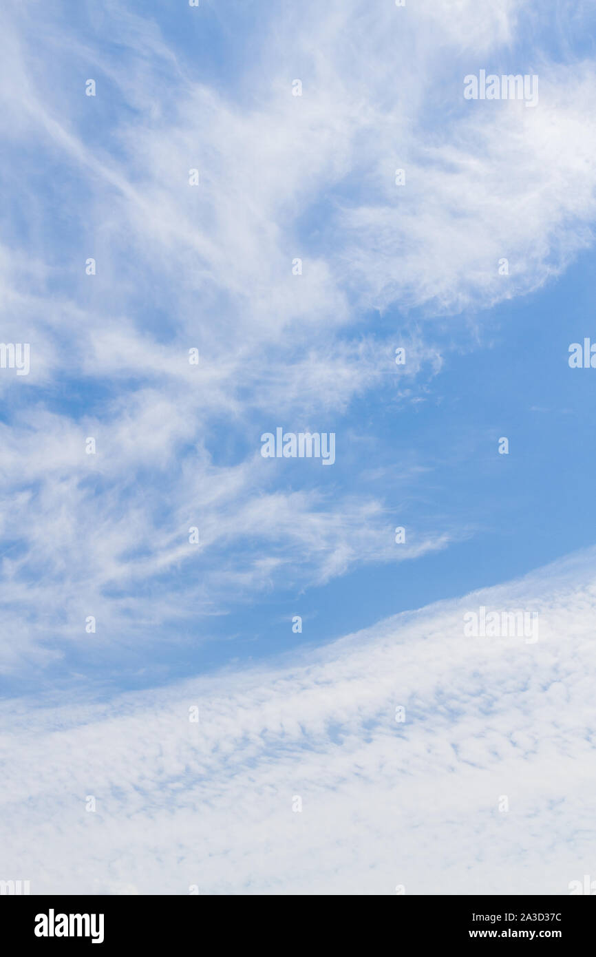 White fluffy clouds in the blue sky in summer Stock Photo - Alamy