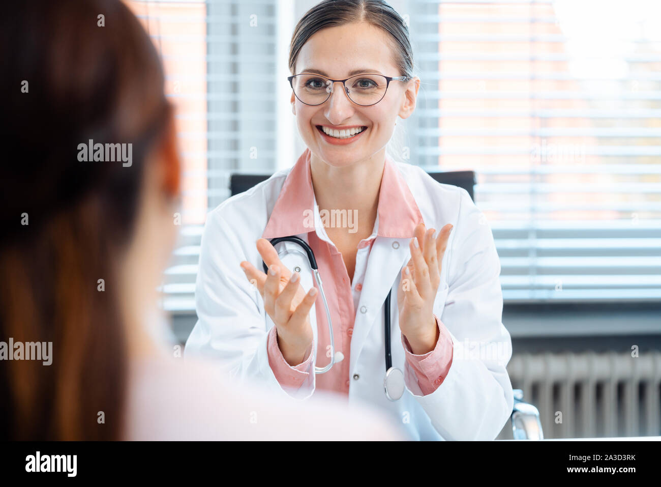 Medical doctor woman positive talking hi-res stock photography and ...