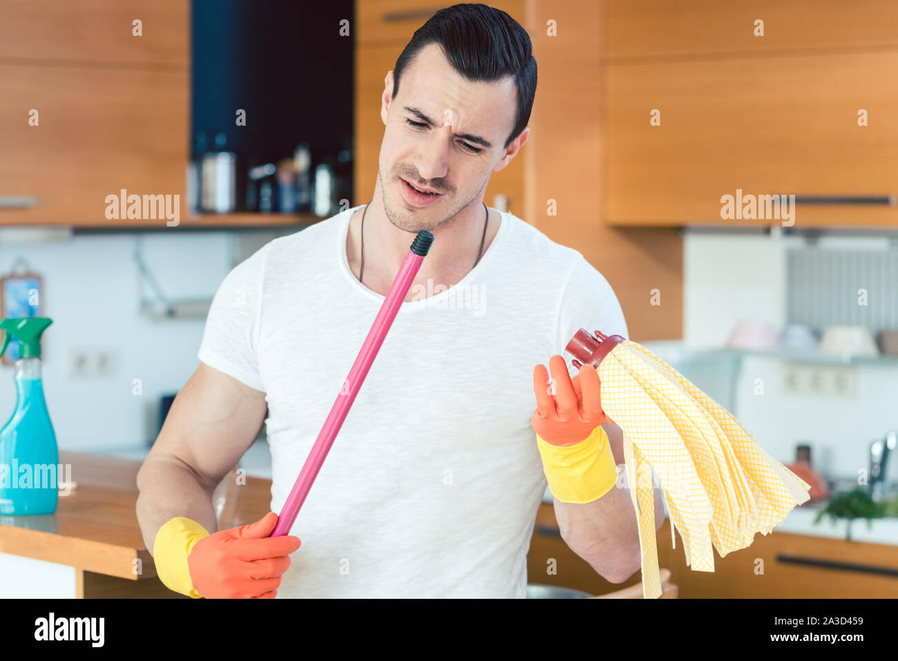 Man is a bit overwhelmed by the duties of a homemaker Stock Photo