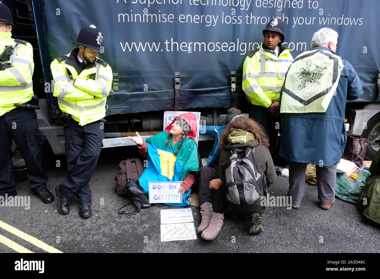 Westminster, London, UK - Monday 7th October 2019 - Several Extinction Rebellion XR climate protesters have locked themselves onto a lorry in Marsham Street just outside the Home Office - Police have surrounded the vehicle. Photo Steven May / Alamy Live News Stock Photo