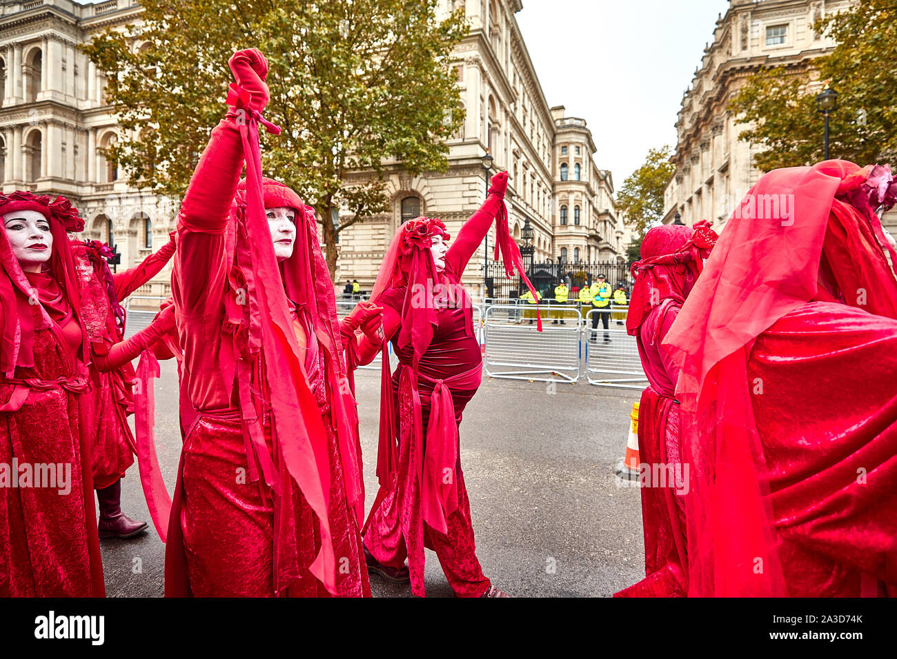 London, U.K. - Oct 7, 2019: Environmental campaigners from Extinction Rebellion pass Downing Street on the first day of a planned two weeks of protests. Stock Photo