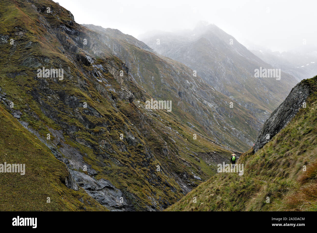 Hikers in Umbaltal/Virgental on a rainy day in the Hohe Tauern National Park in Austria Stock Photo