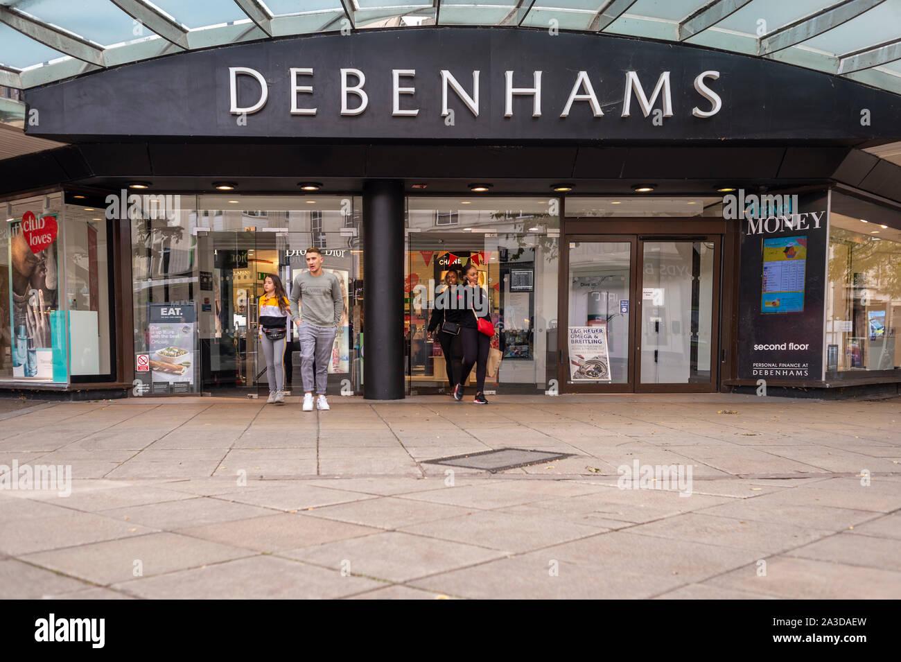 shoppers coming out of a Debenhams department store. Stock Photo