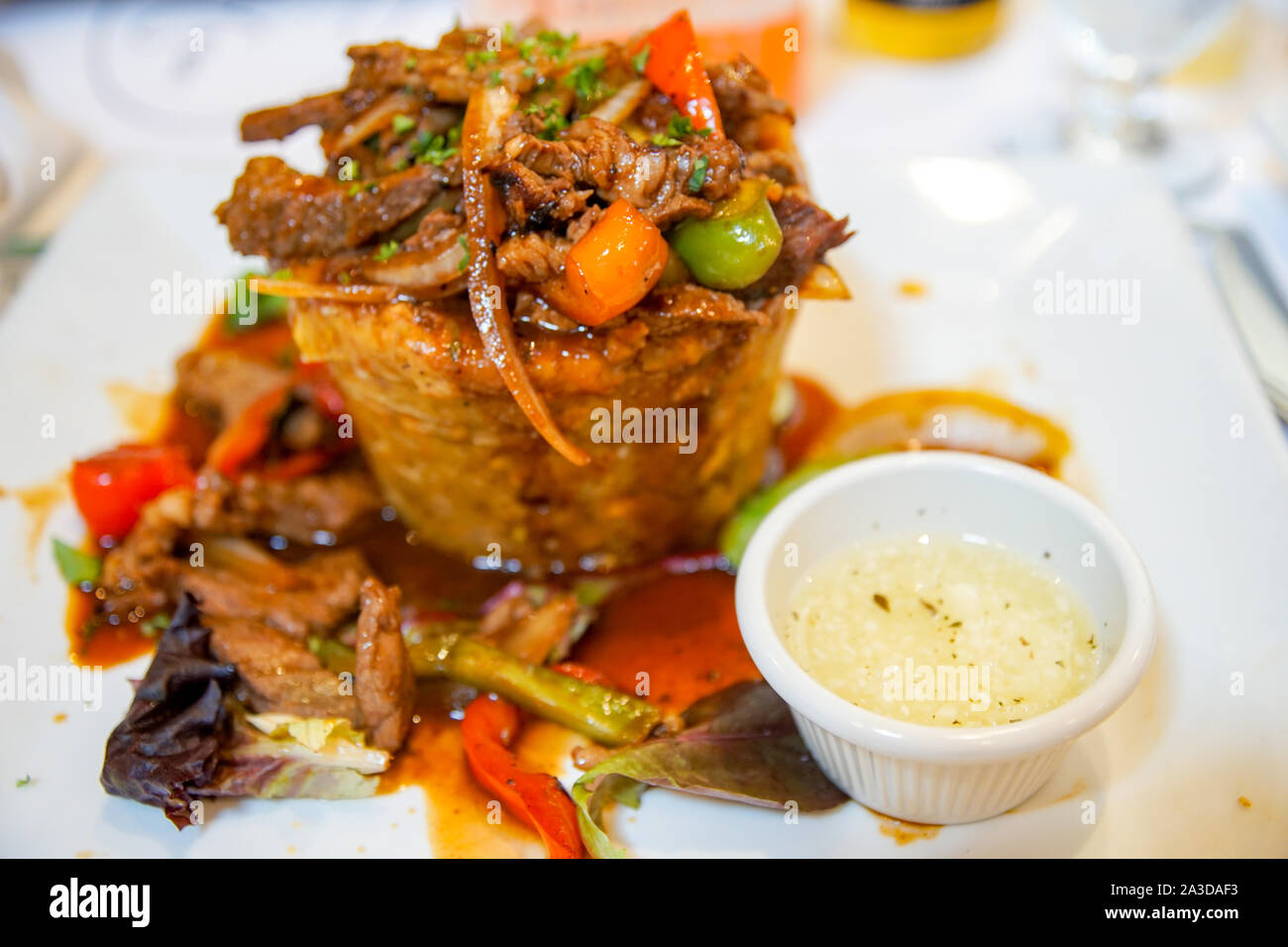 Delicious Puerto Rican Mofongo with Steak and Garlic Sauce. Stock Photo