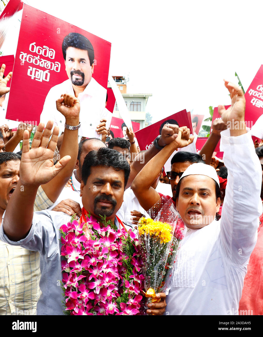 colombo-sri-lanka-07th-oct-2019-presidential-candidate-of-marxist-jvp-or-the-peoples-liberation-front-anura-kumara-dissanayaka-waves-to-supporters-he-leaves-the-election-commission-after-handing-over-nominations-papers-in-colombo-sri-lanka-monday-october-7-2019-photo-by-saman-abesiriwardanapacific-press-credit-pacific-press-agencyalamy-live-news-2A3DAH5.jpg