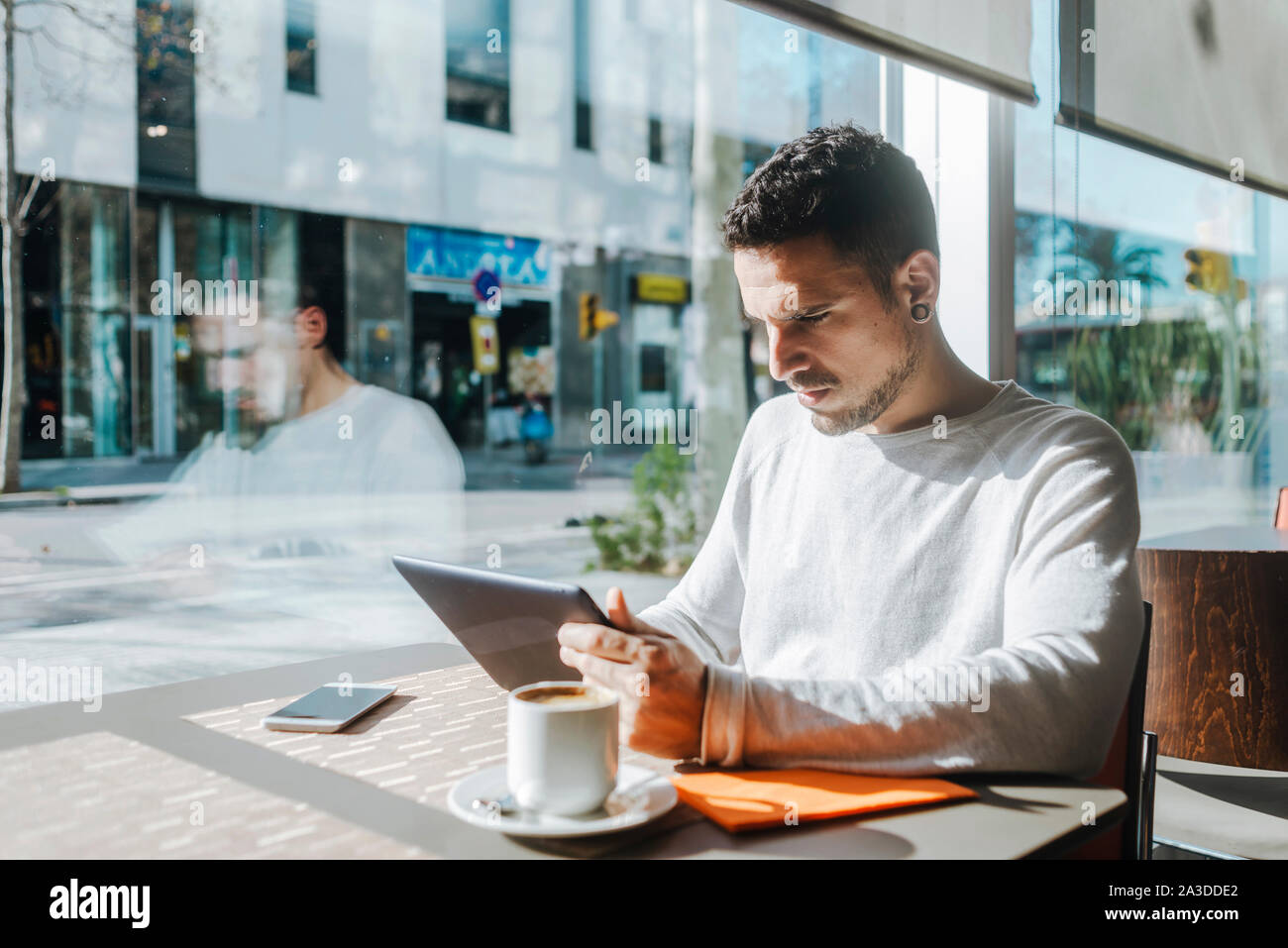Man Using Sidchrome Young man notepad using hi-res stock photography and images - Alamy