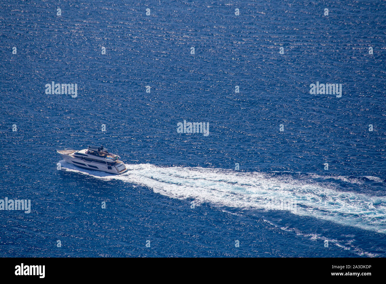 Motor yacht passing the west coast of Lefkada / Lefkas Island, Greece Stock Photo
