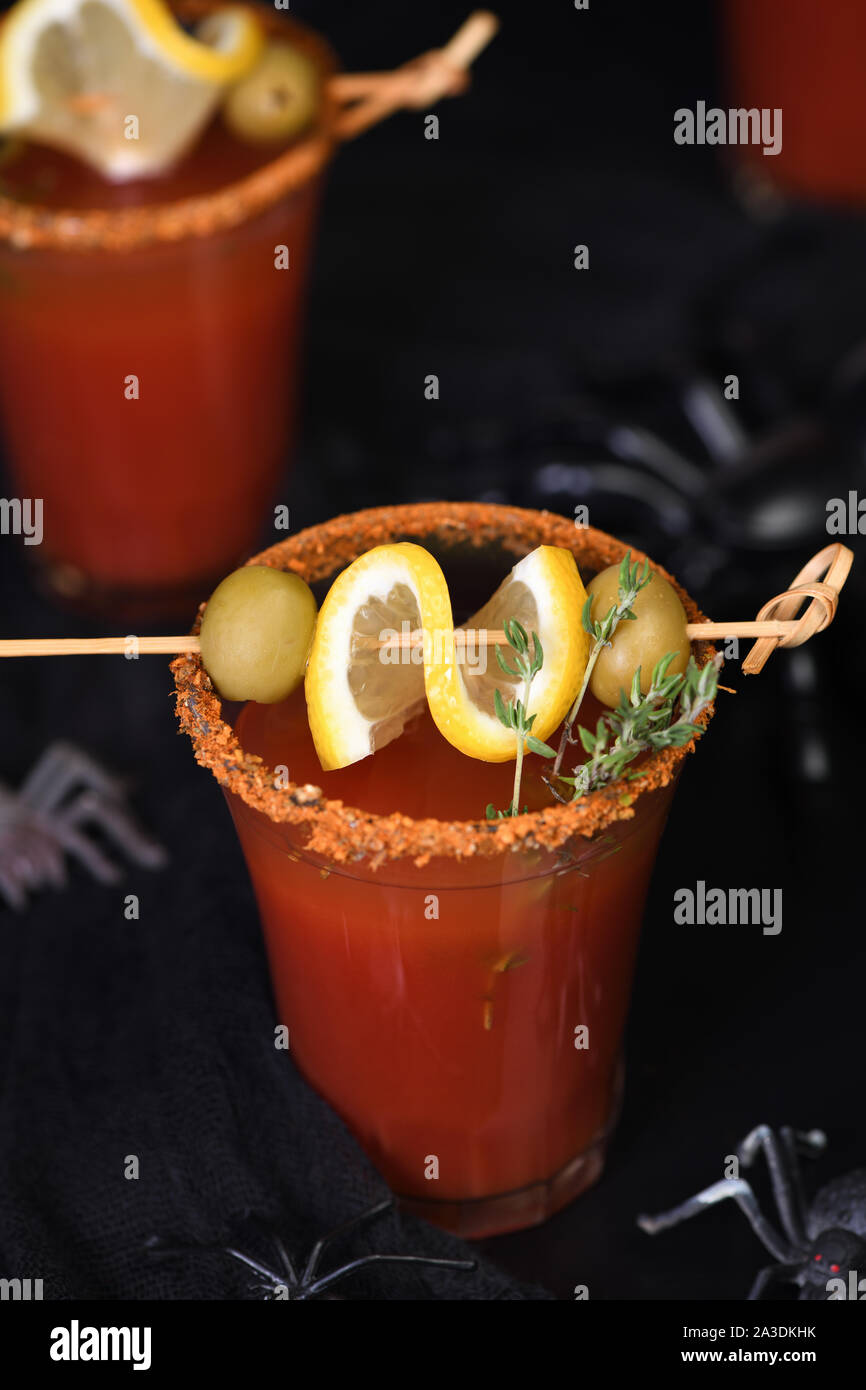 Michelada - Mexican alcoholic cocktail, tomato juice, spicy sauce and spices. Great idea for a Halloween party. Stock Photo