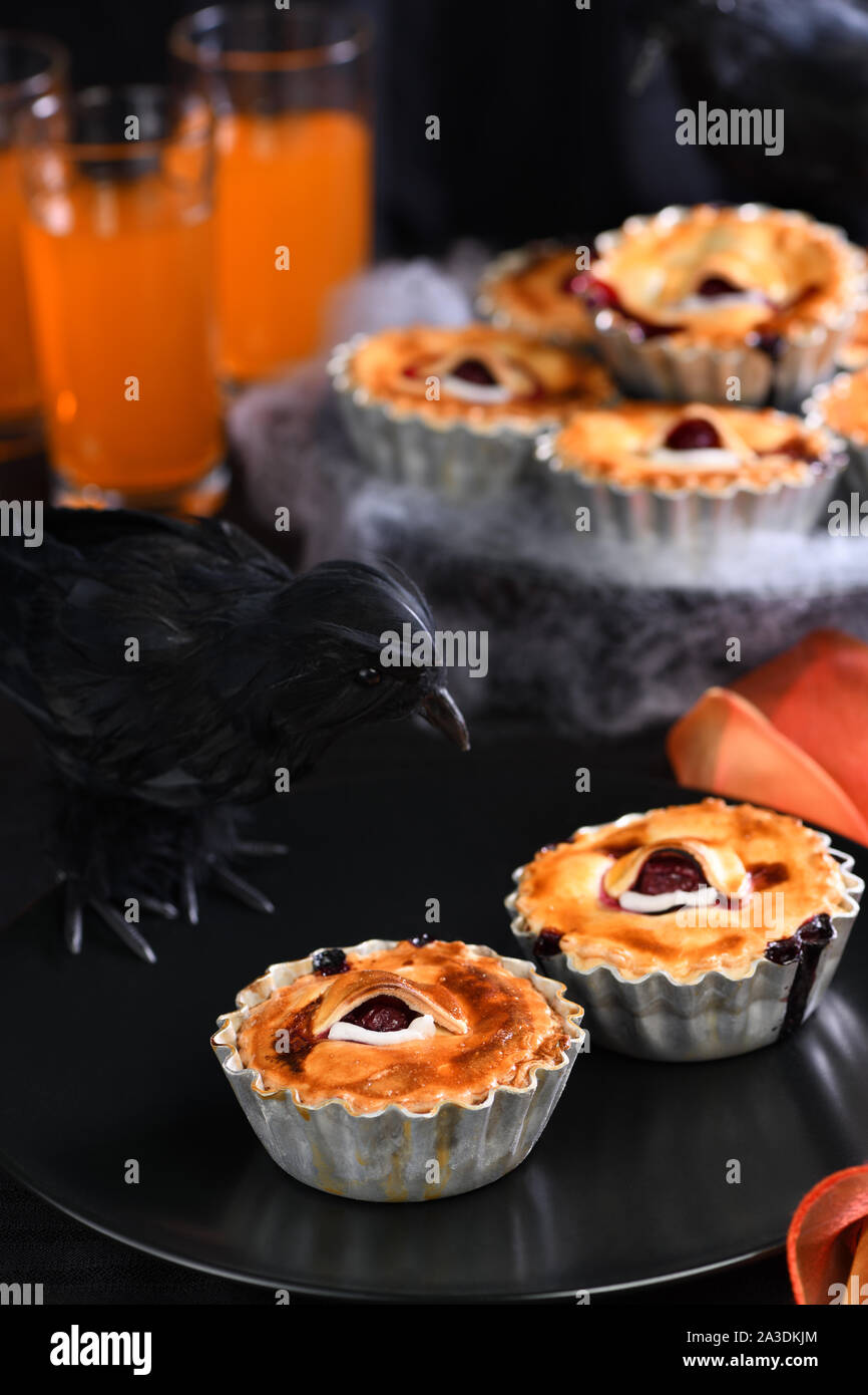 Halloween mini Creepy Eye Cakes with cherry filling Stock Photo