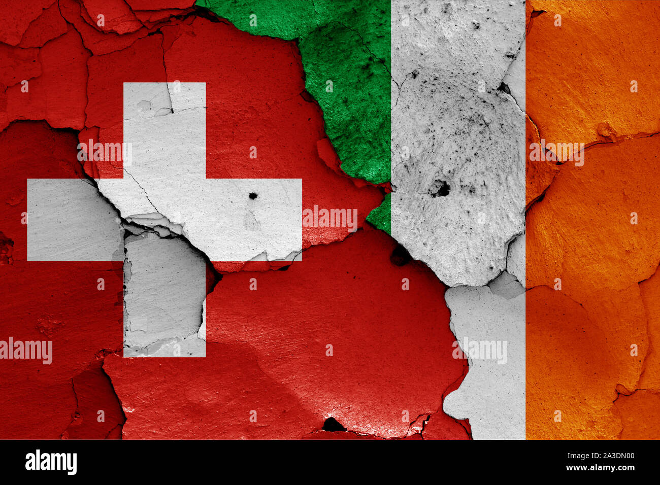 flags of Switzerland and Ireland painted on cracked wall Stock Photo ...