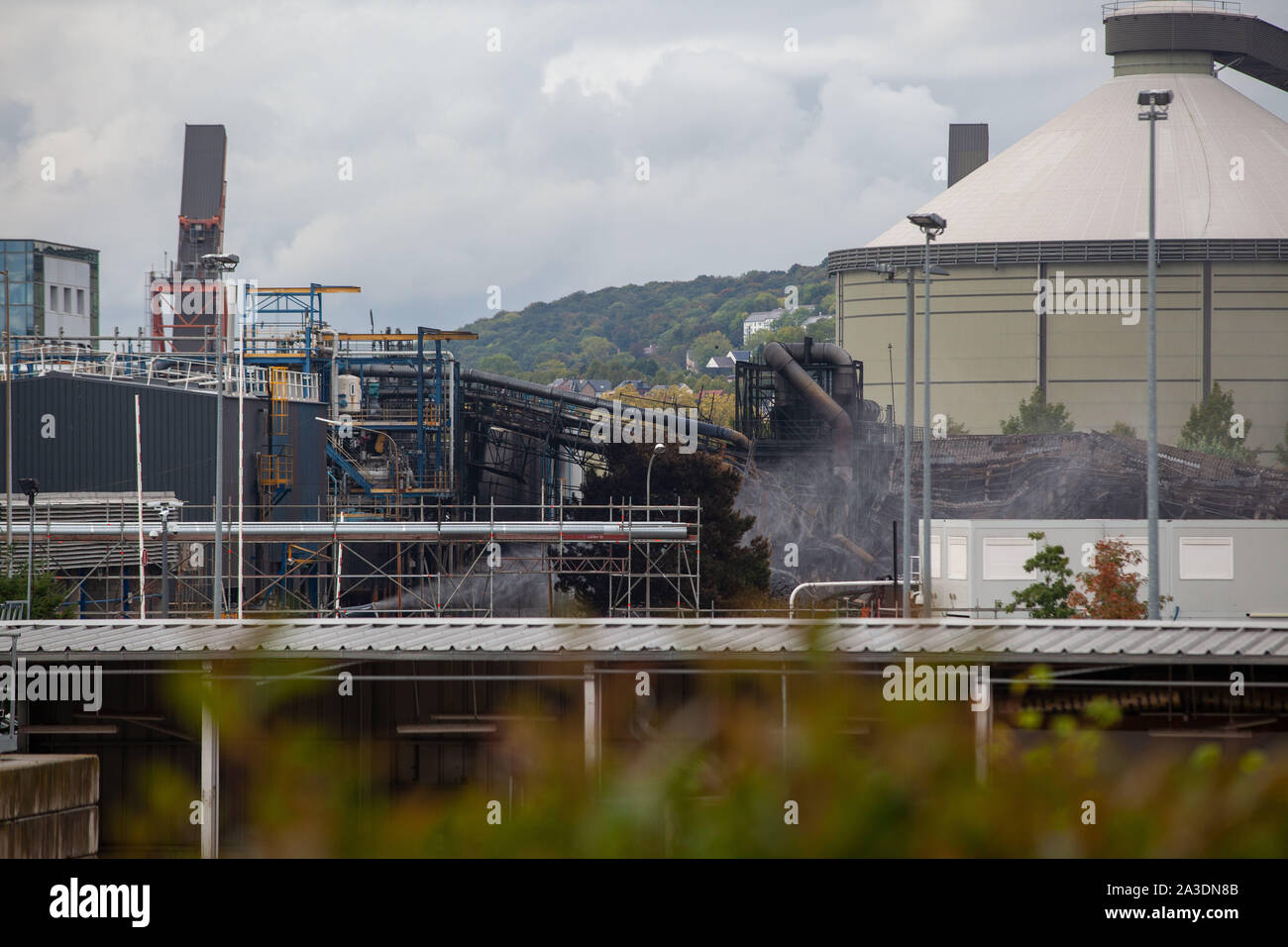 A week after a fire ravaged the Lubrizol plant in Rouen, smoke is still coming from the plant site. Uncertainties remain about the consequences of the combustion of chemicals and pollution. Following the fire on September 26th harvesting fruit and vegetables was banned in a hundred municipalities in Normandy and the Hauts-de-France. Water and fire, smoke. Stock Photo