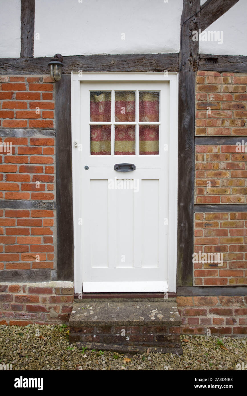 White cottage door. Oxfordshire, England Stock Photo
