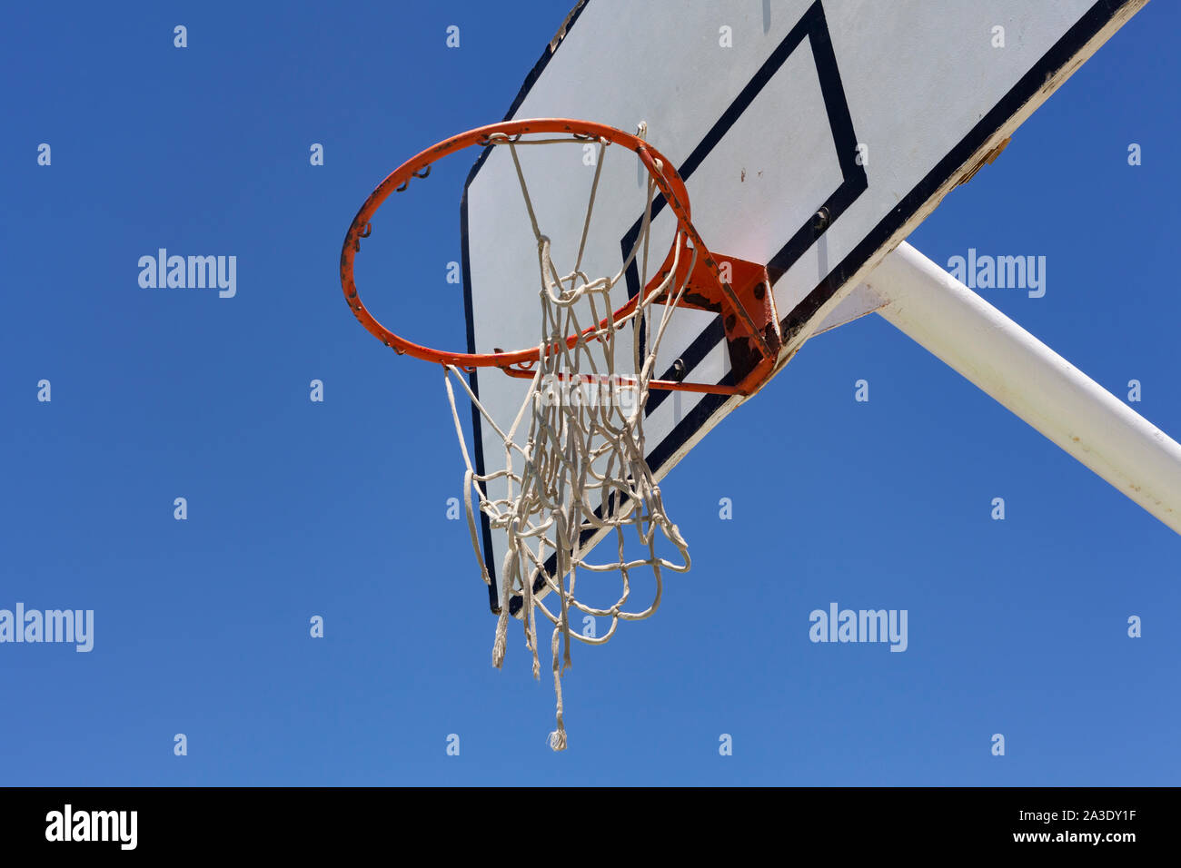 Outdoor basketball hoop against a blue sky - street basketball Stock Photo