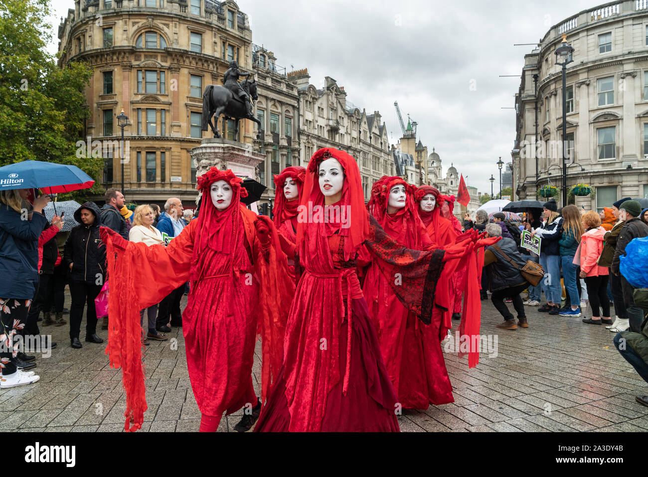 7th Oct 2019 - London, UK. 'The Red Brigade' activists take part in the Extinction Rebellion protest at Trafalgar Square in London. Stock Photo
