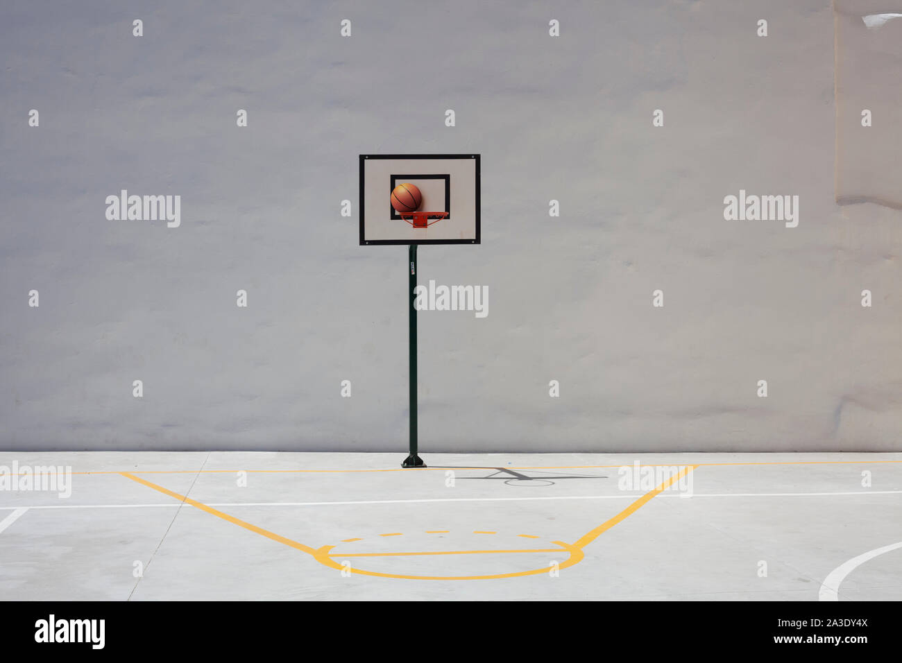 Basketball Hoop and Court With White Backboard with Room for Copy Stock Photo