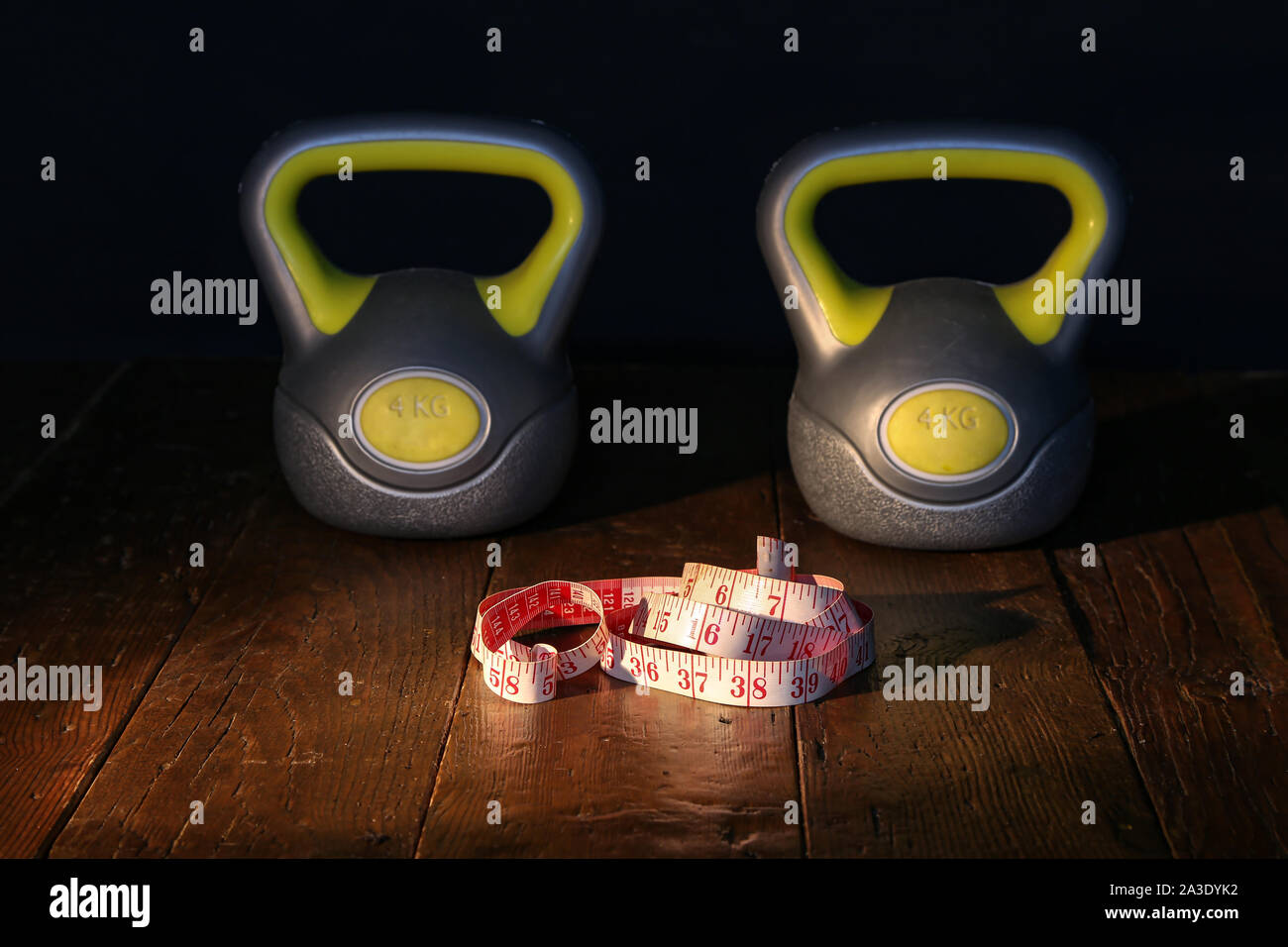 Multicolored weights and dumbbells at the fitness center Stock Photo