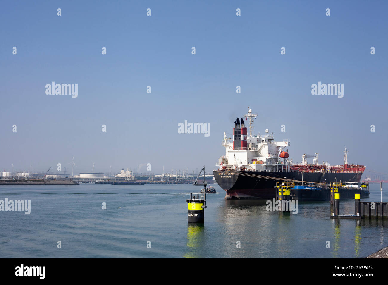 Berth - a place near the shore for mooring a vessel or boats in the Port of Rotterdam Stock Photo