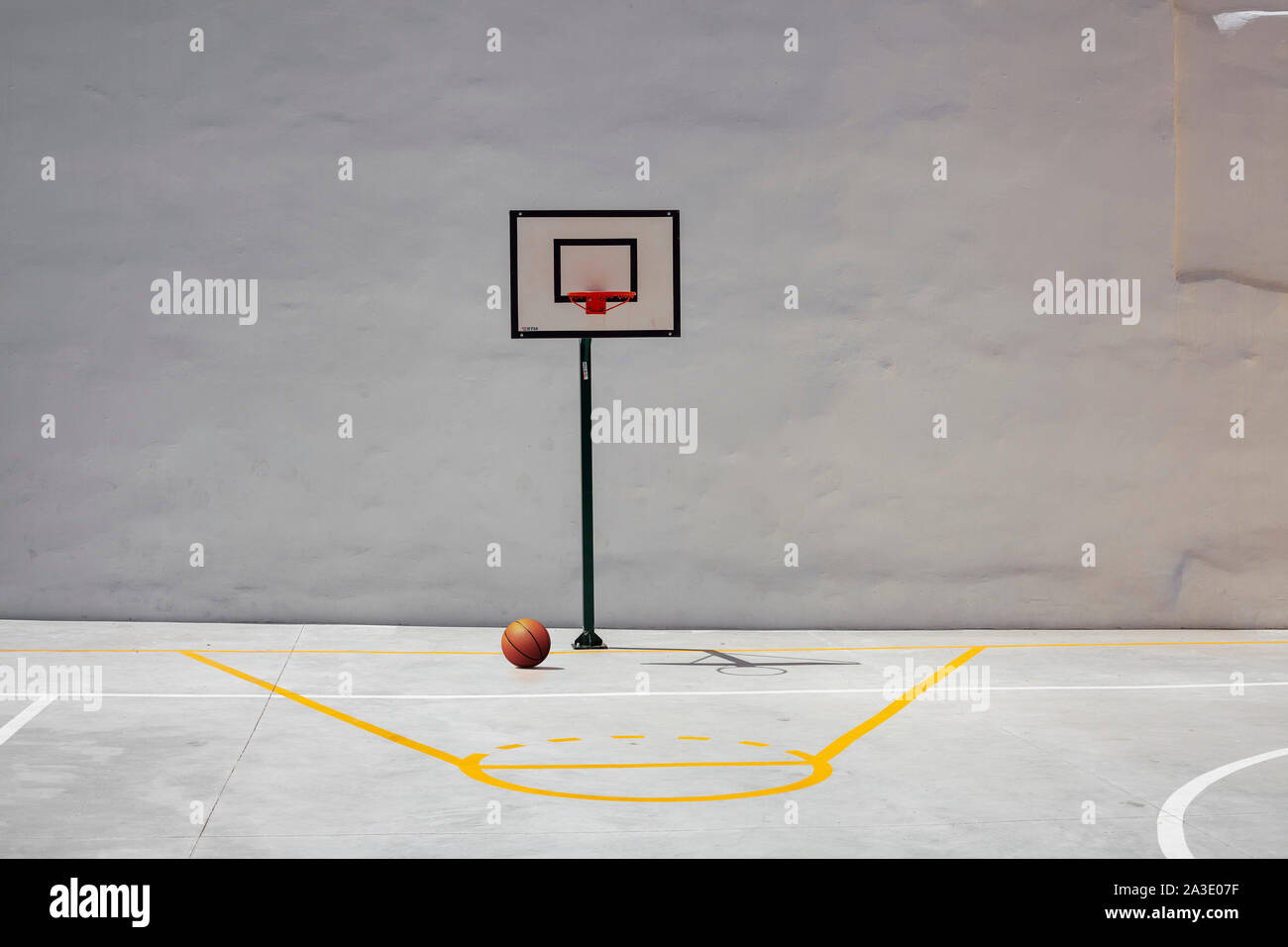 Basketball Hoop and Court With White Backboard with Room for Copy Stock Photo