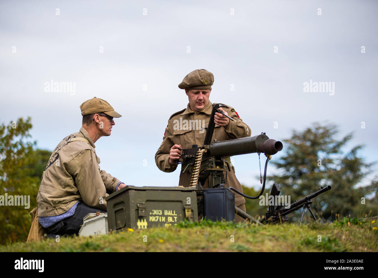 Two soldiers dressed in military uniforms with a machine gun. Hope and Glory 2019 Gravesend Fort Gardens .Credit Andrew Beck Stock Photo