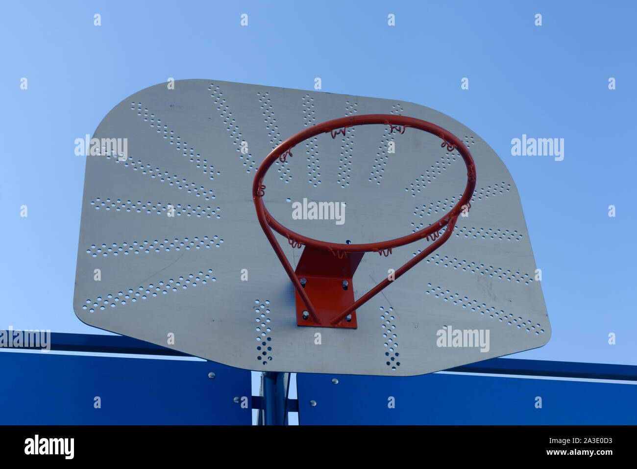 Outdoor basketball hoop against a blue sky - street basketball Stock Photo