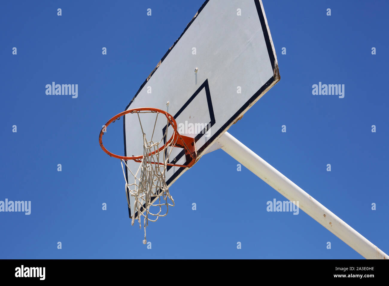 Outdoor basketball hoop against a blue sky - street basketball Stock Photo