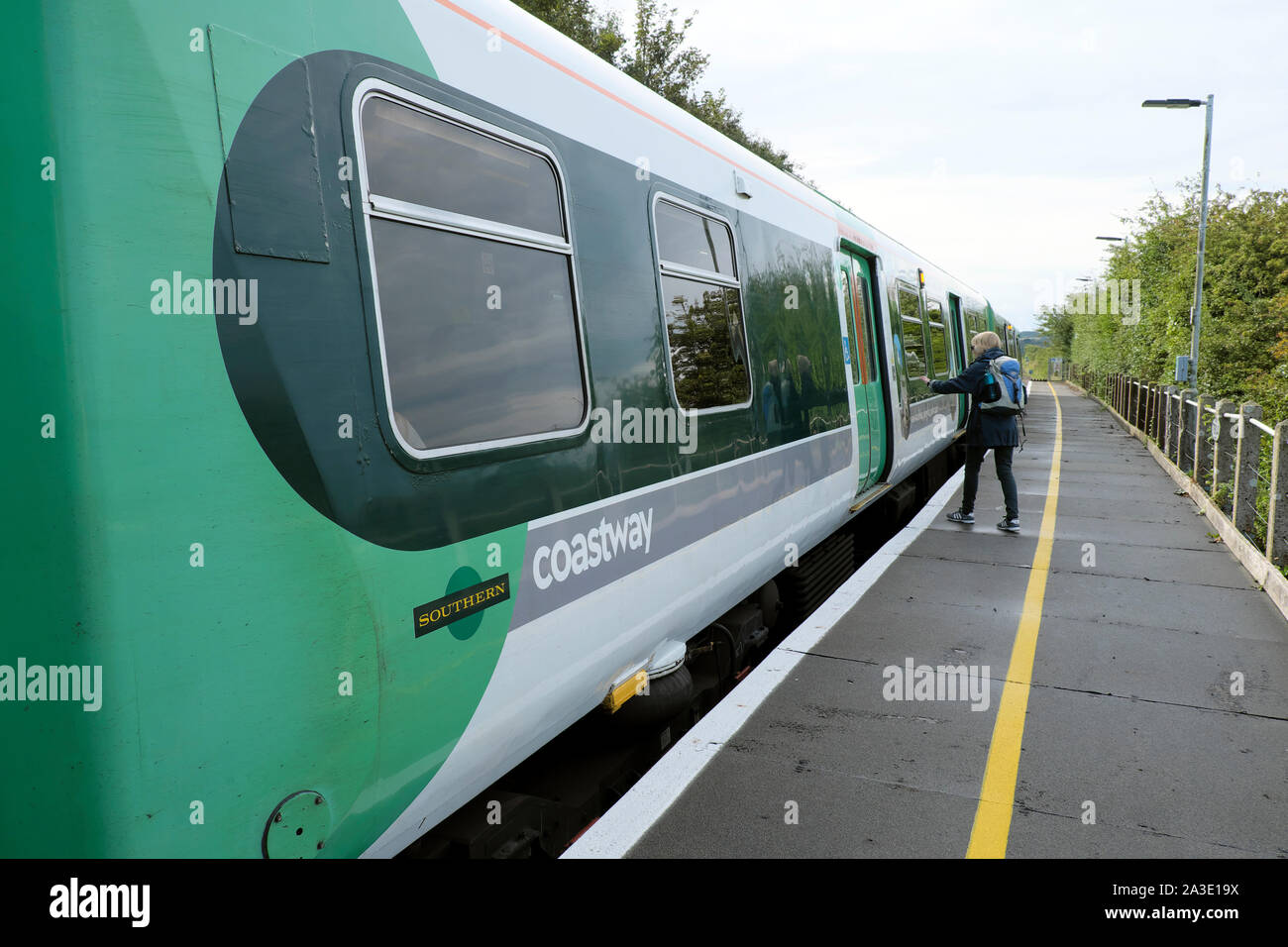Passenger boarding Southern Rail Coastway train carriage at Southease Station heading for Brighton East Sussex England UK  KATHY DEWITT Stock Photo