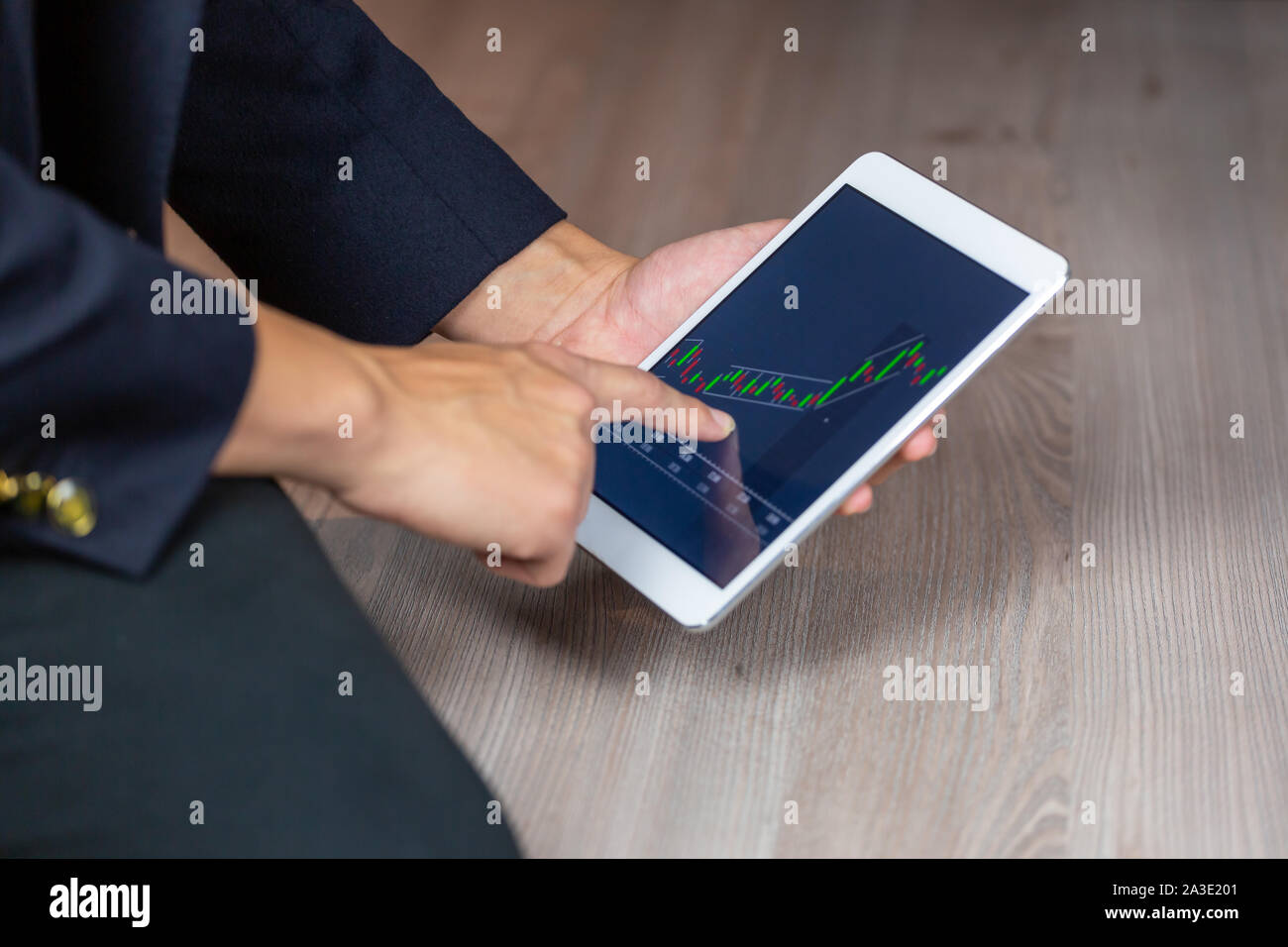 Stock Trader Looking At Stock Chart on Screen Stock Photo