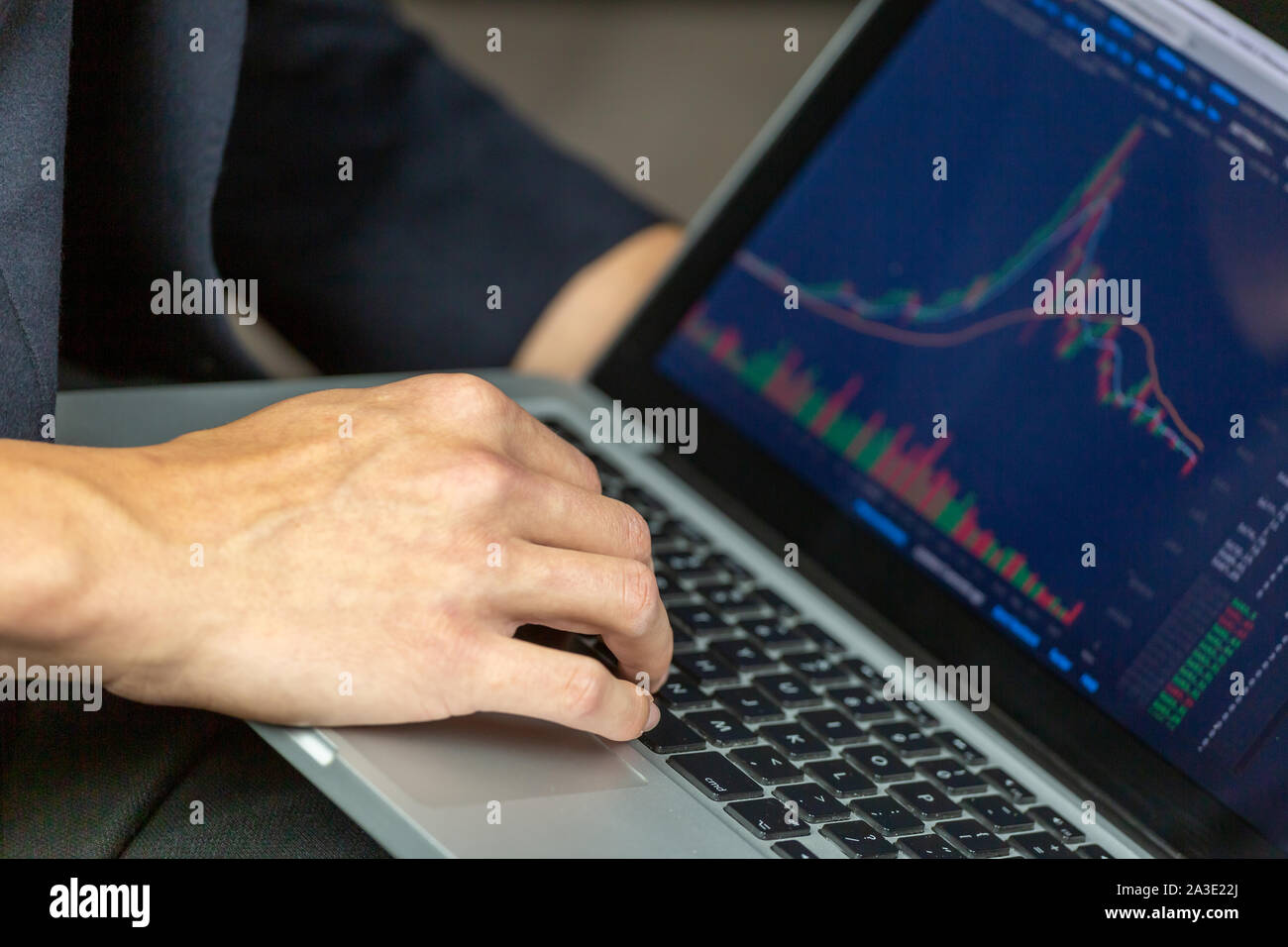 Stock Trader Looking At Stock Chart on Screen Stock Photo