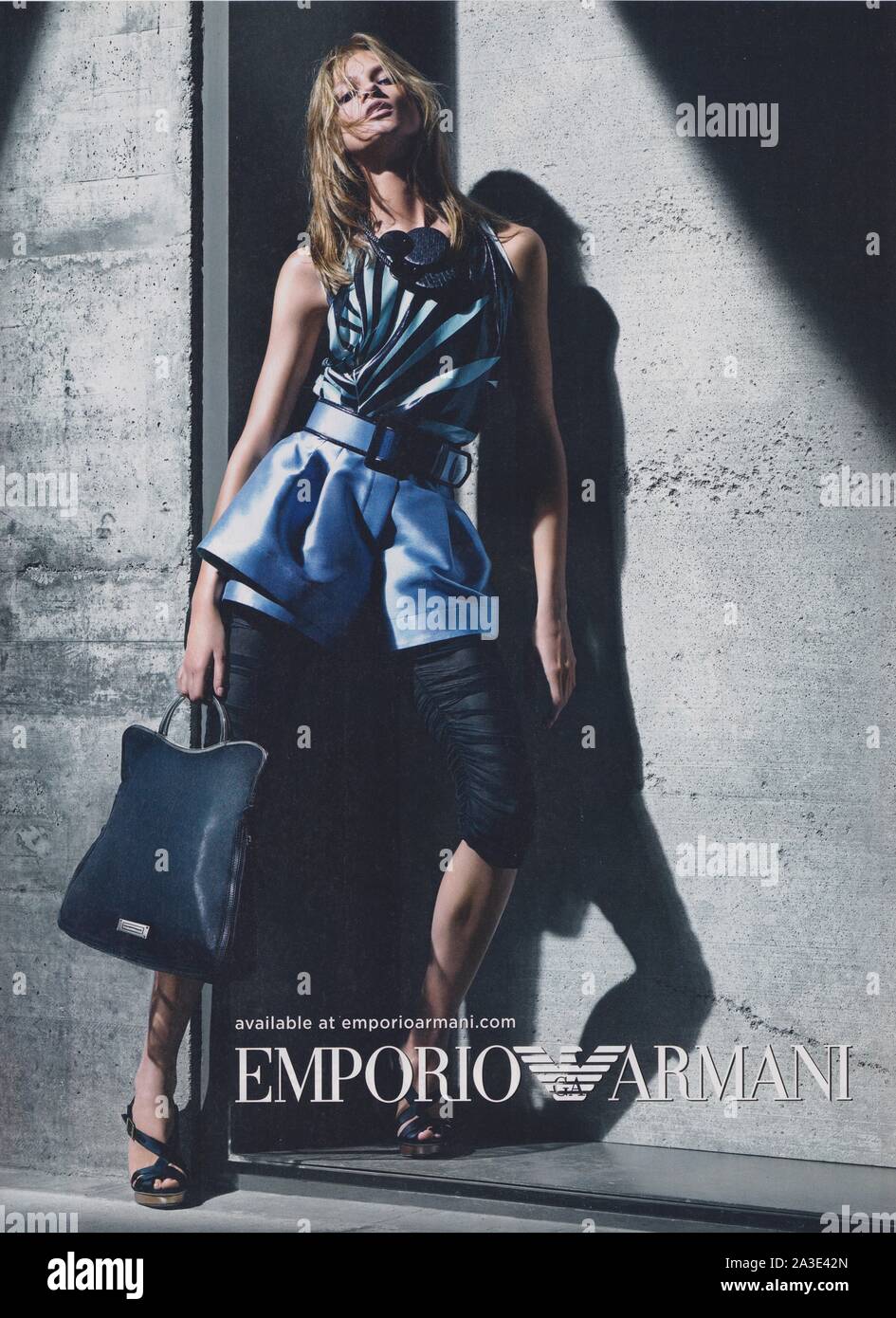 poster advertising Emporio Armani by Giorgio Armani with Anna Selezneva in  magazine from 2011, advertisement creative Emporio Armani advert from 2010s  Stock Photo - Alamy