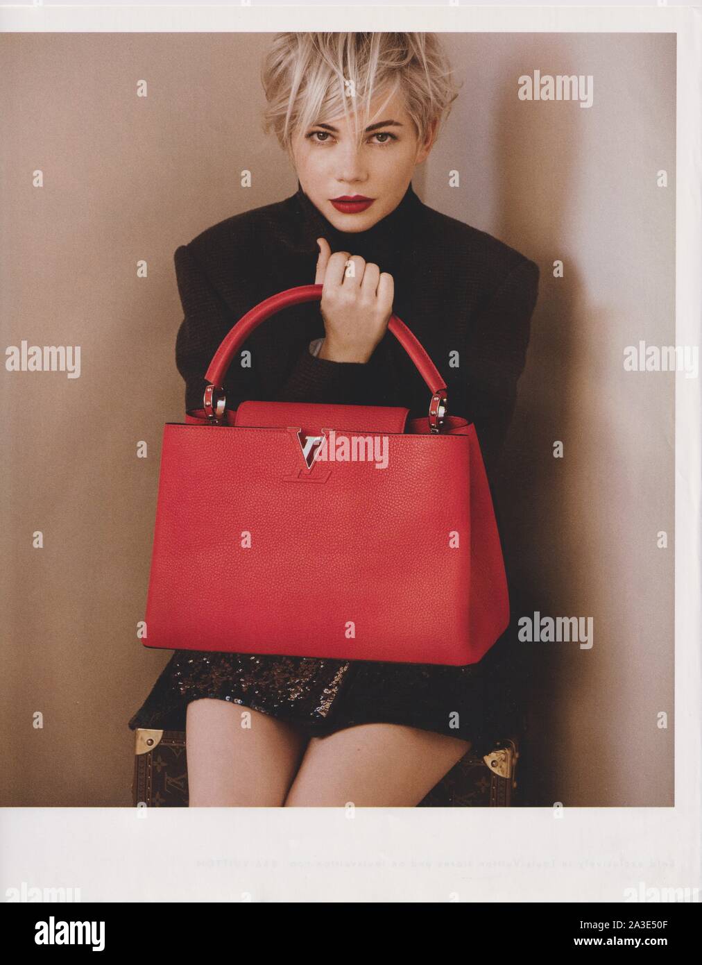 poster advertising Louis Vuitton handbag with Michelle Williams actress in paper magazine from 2013, advertisement, creative advert from 2010s Stock Photo