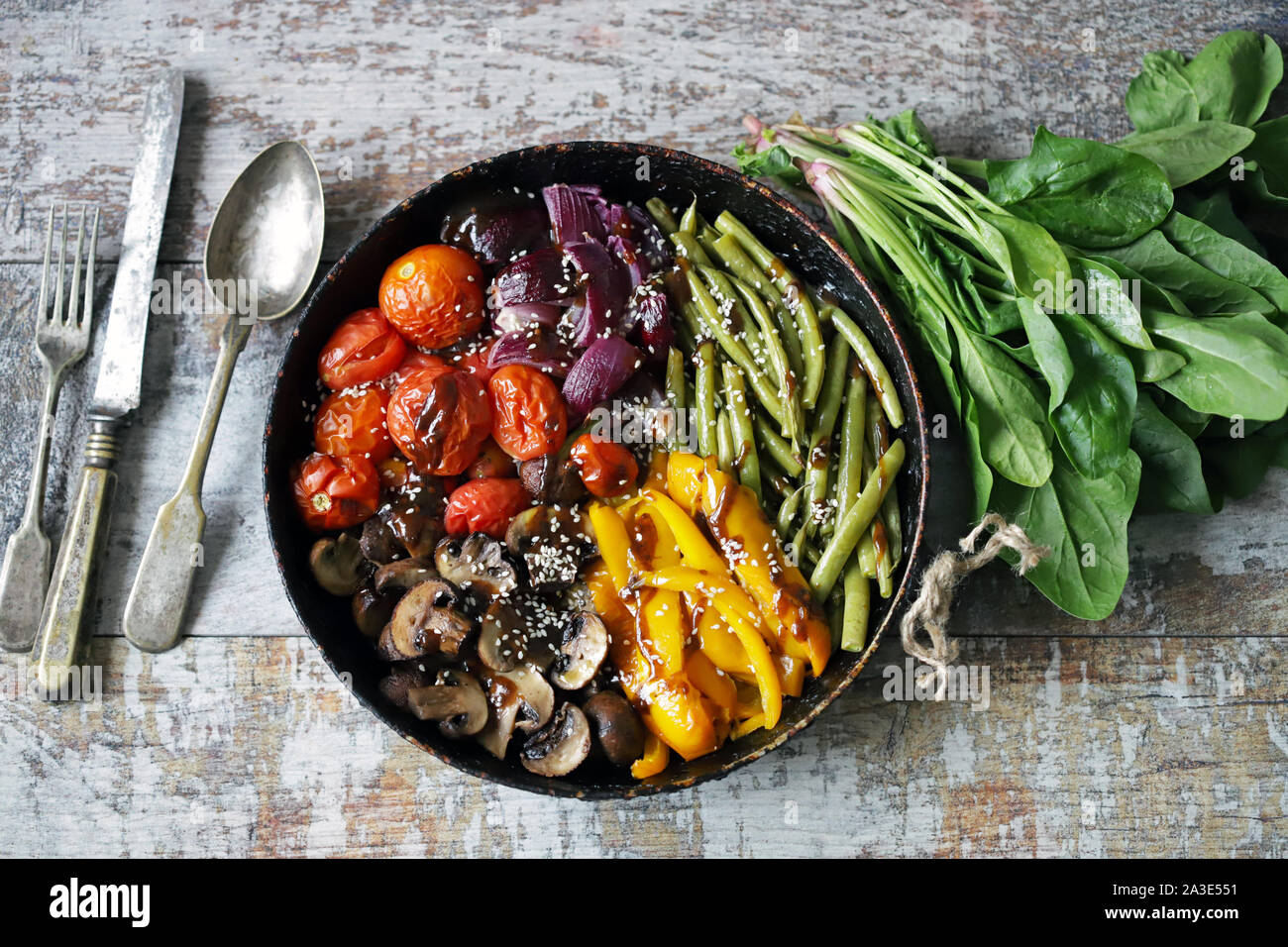 Baked vegetables in a pan. Vegan dish. Autumn food. Stock Photo