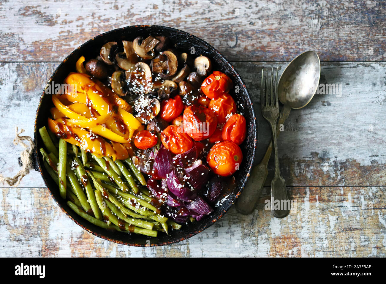 Baked vegetables in a pan. Vegan dish. Autumn food. Stock Photo