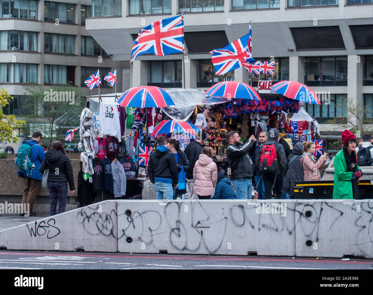 London, UK. 7th Oct 2019. UK Weather:A stall outside St Thomas' Hospital sells union flag umbrella's on a dull and wet start to the week. Celia McMahon/Alamy Live News. Credit: Celia McMahon/Alamy Live News Stock Photo