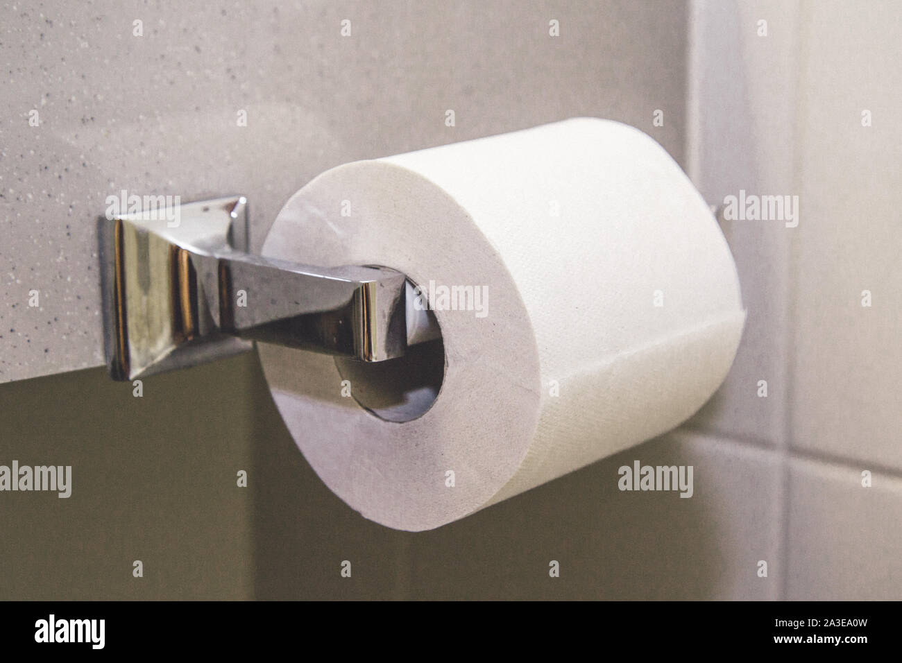 Roll bath , bathroom of wc paper , toilet use sheets to clean or wash. White modern building tissue paper and holder luxury hotel style . Stock Photo