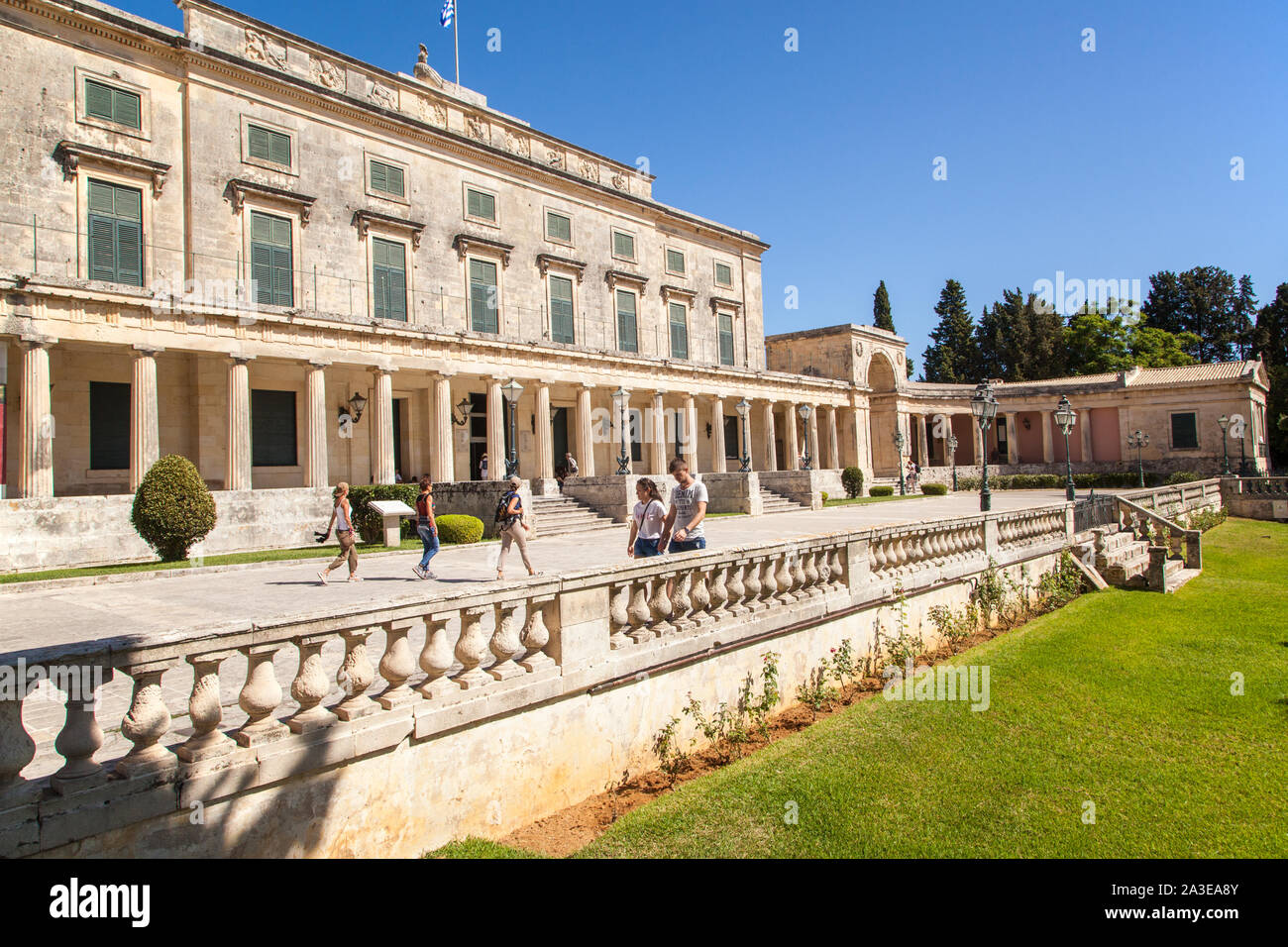 Palace of St Michael and St George in the town of Corfu Greece with tourists holidaymakers and sightseers Stock Photo