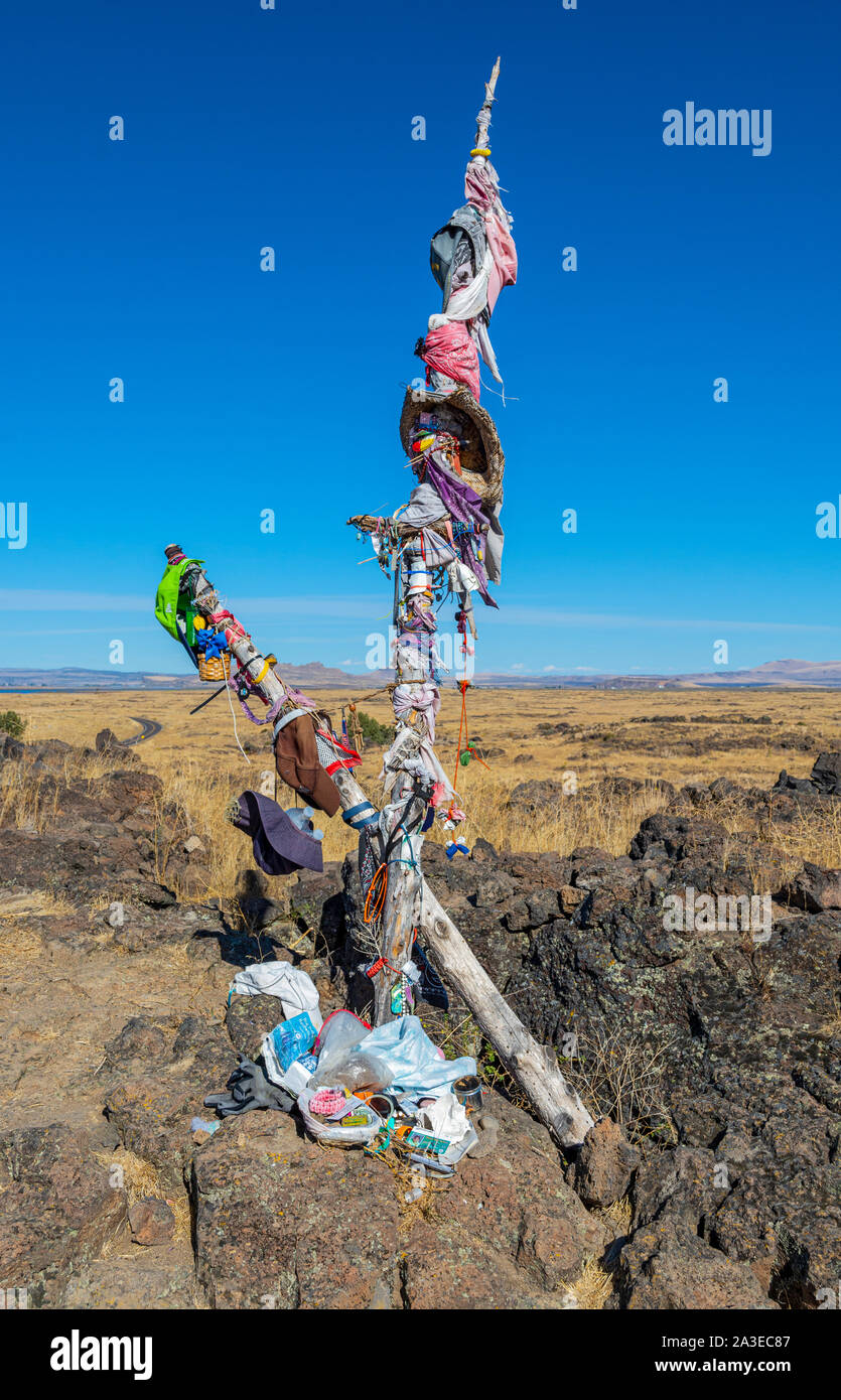 California, Lava Beds National Monument, Captain Jack's Stronghold, native american prayer ribbons and sage offerings hanging on medicine pole Stock Photo