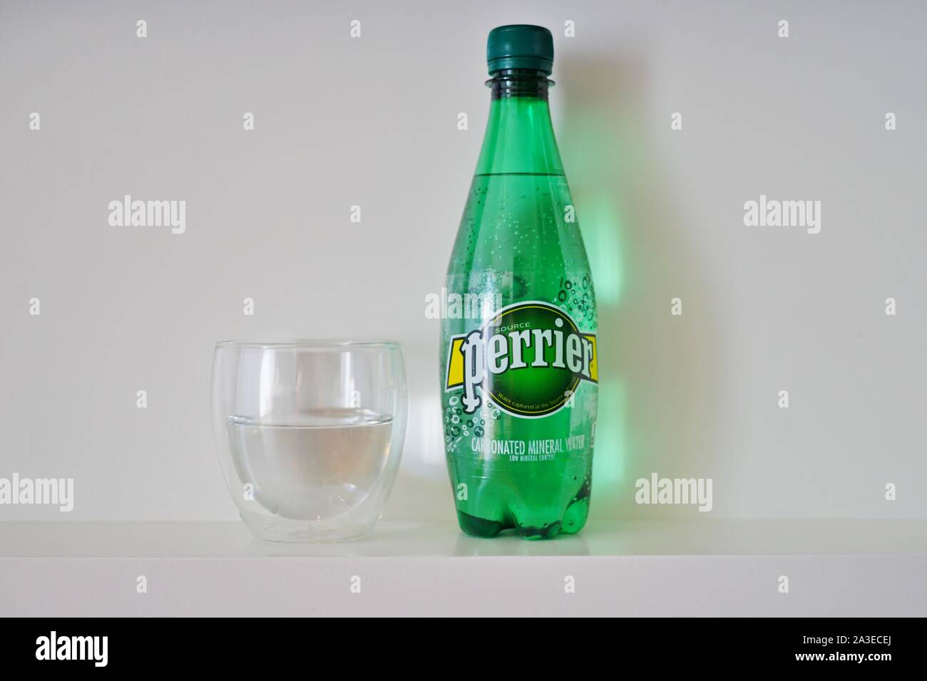 NEW YORK CITY, NY 4 OCT 2019 View of a glass and green plastic bottle